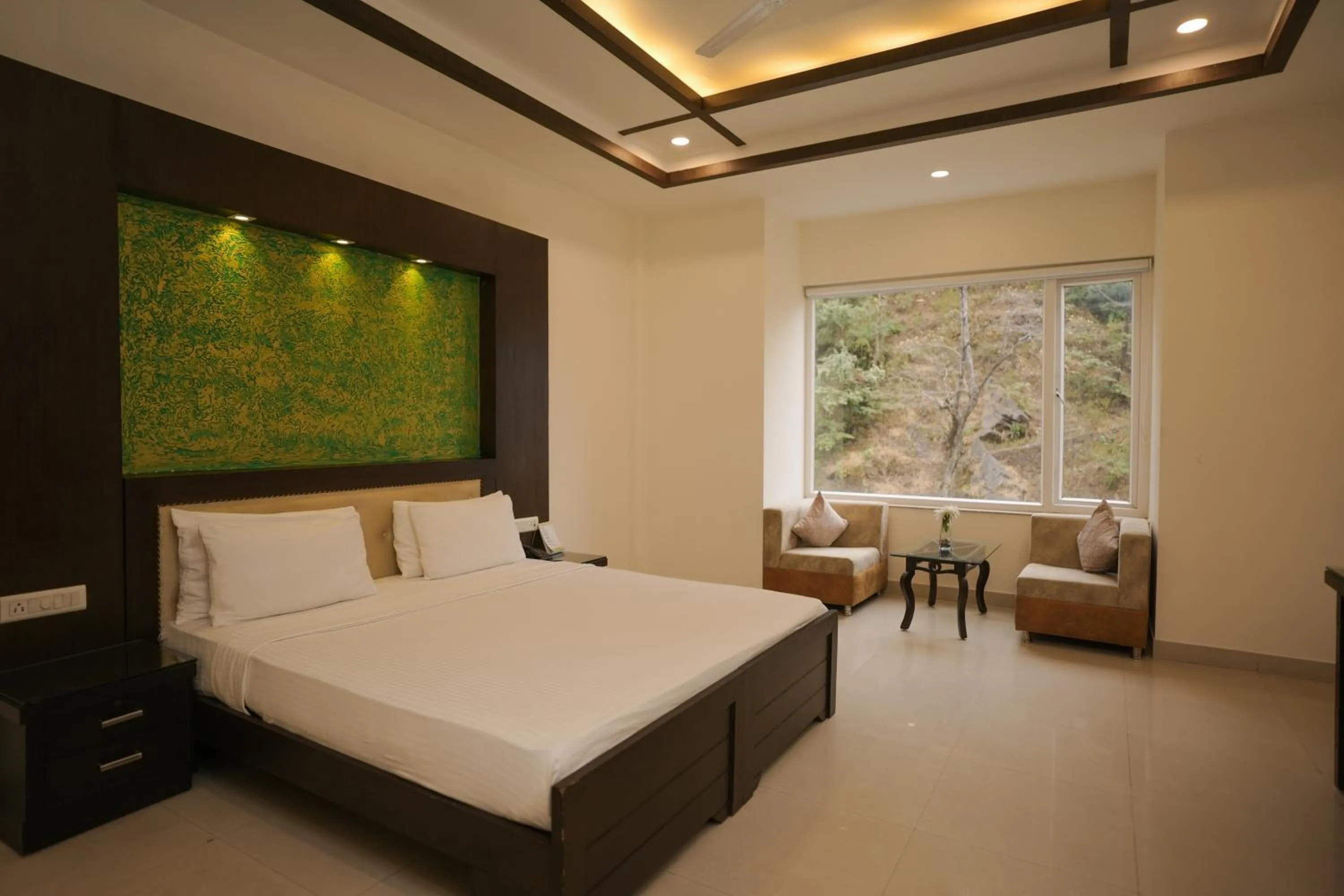 Bed in The Grand Shiva Resort and Spa