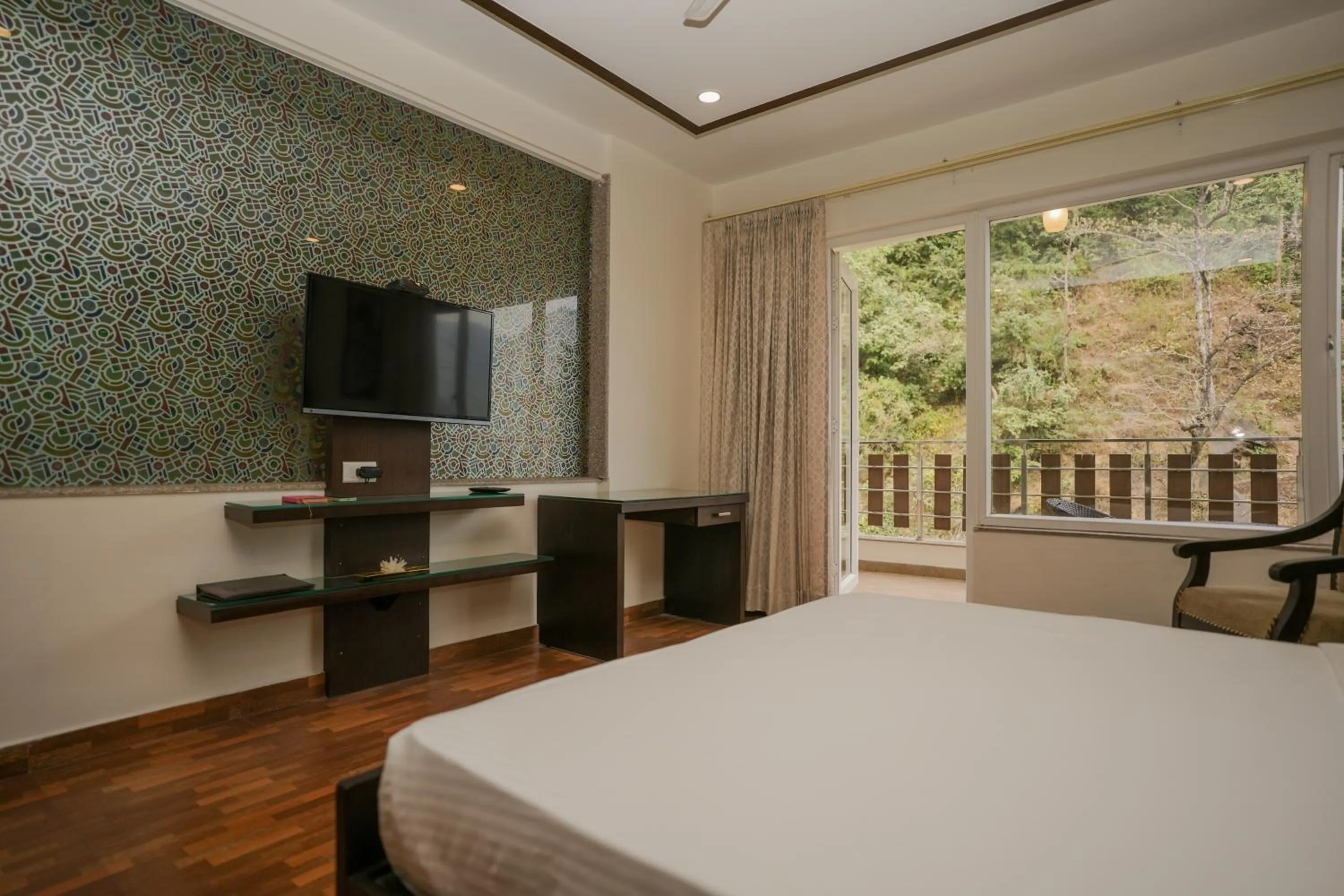 Bed in The Grand Shiva Resort and Spa