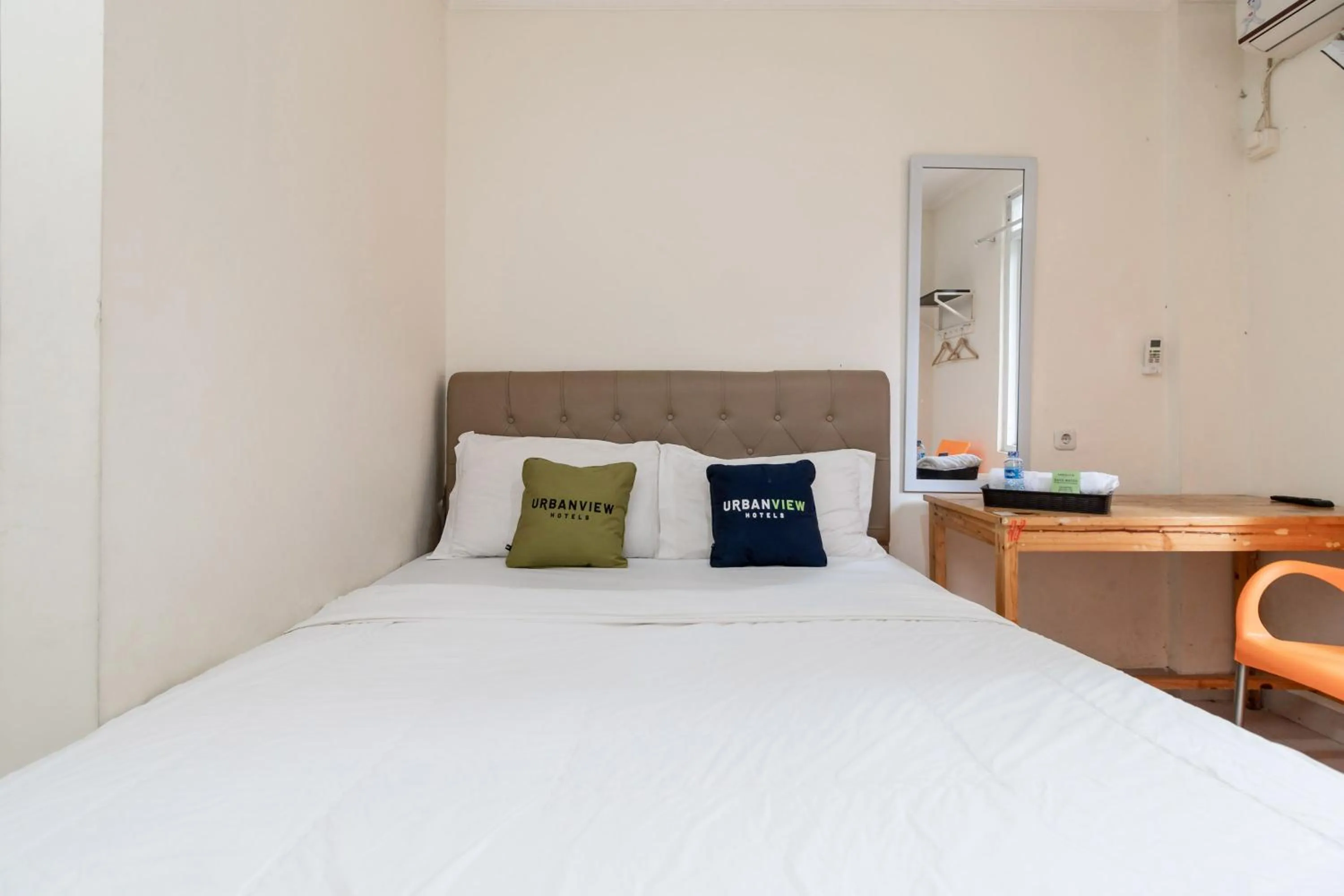 Bed in Urbanview Hotel Minongga Pondok Labu by RedDoorz