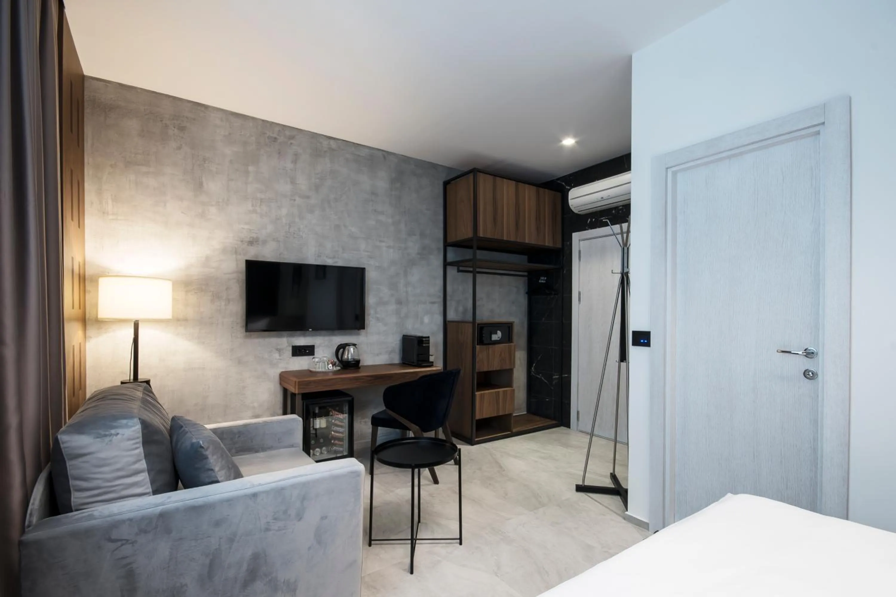 Seating area, Bed in The Location Hotel