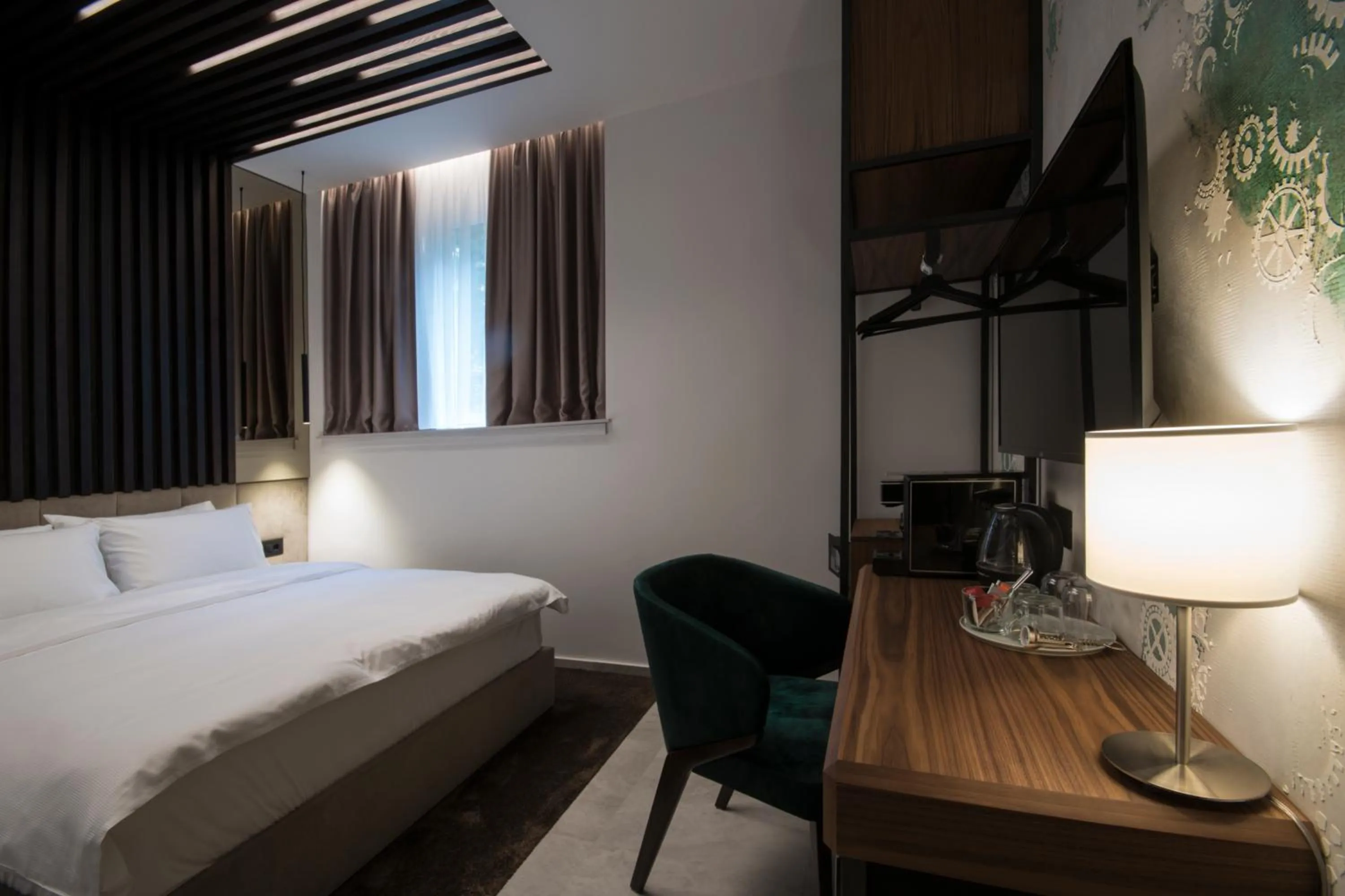 Seating area, Bed in The Location Hotel