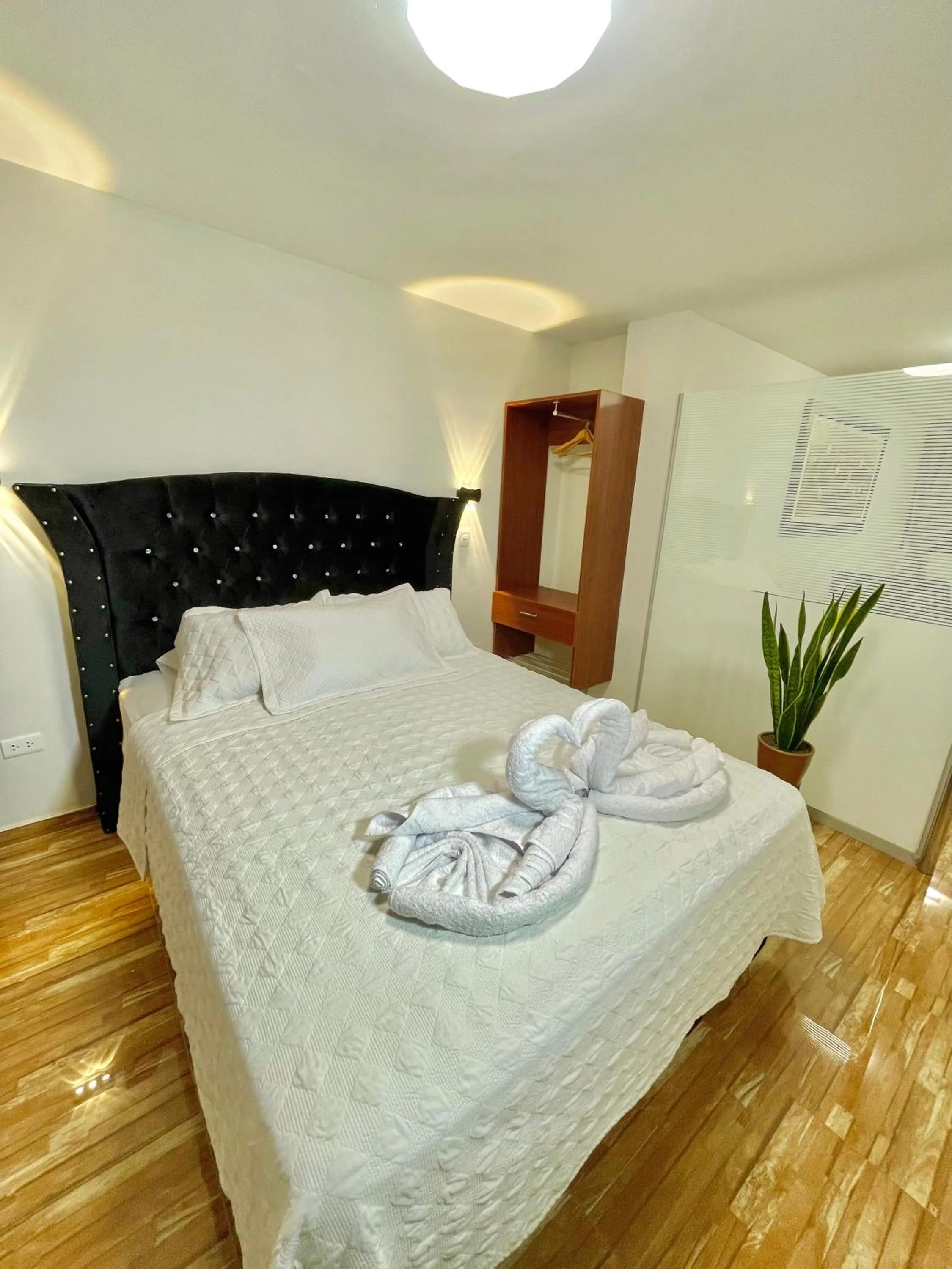 Bed in Jultom Inn Hotel & Suites