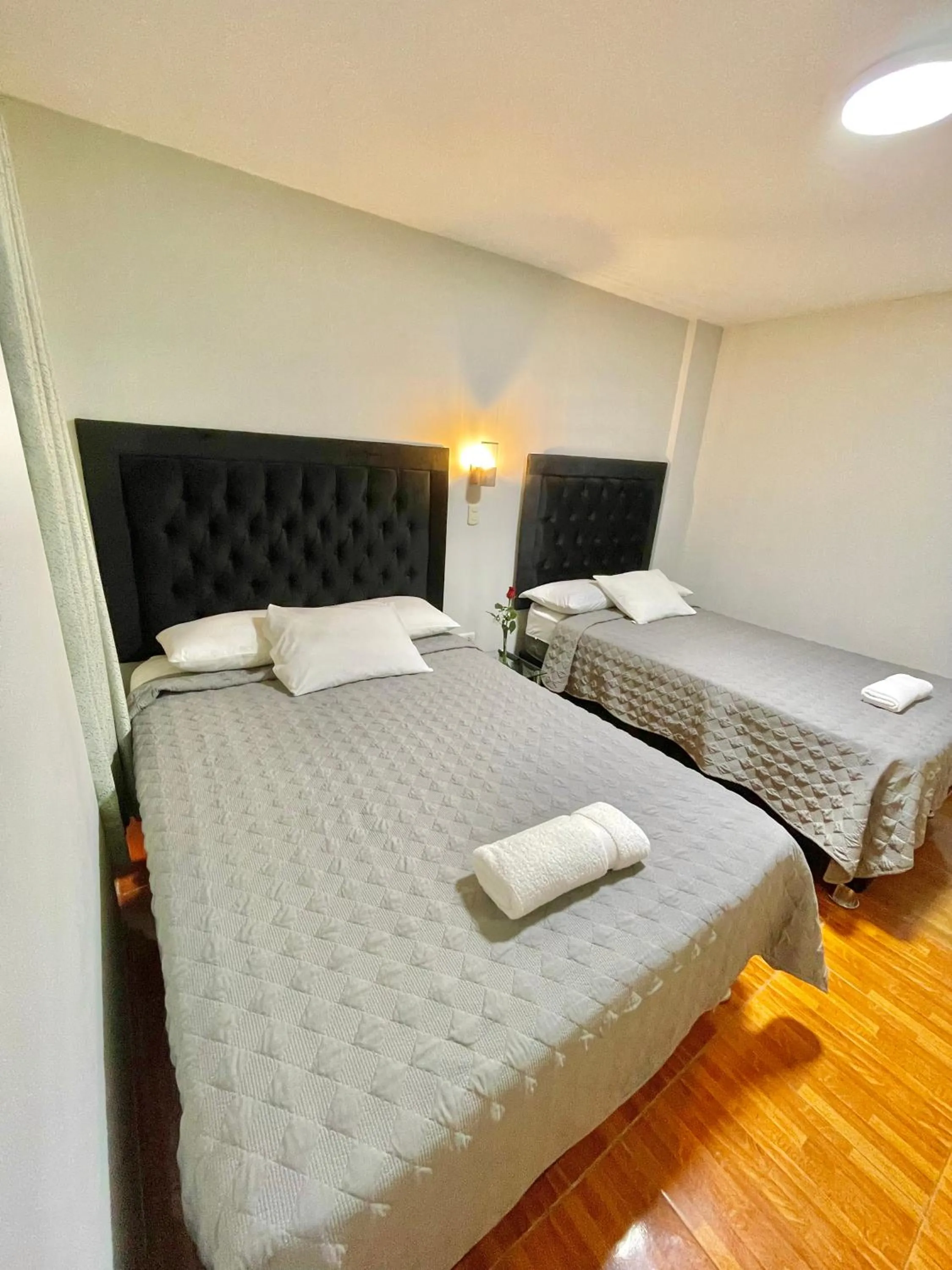 Bed in Jultom Inn Hotel & Suites