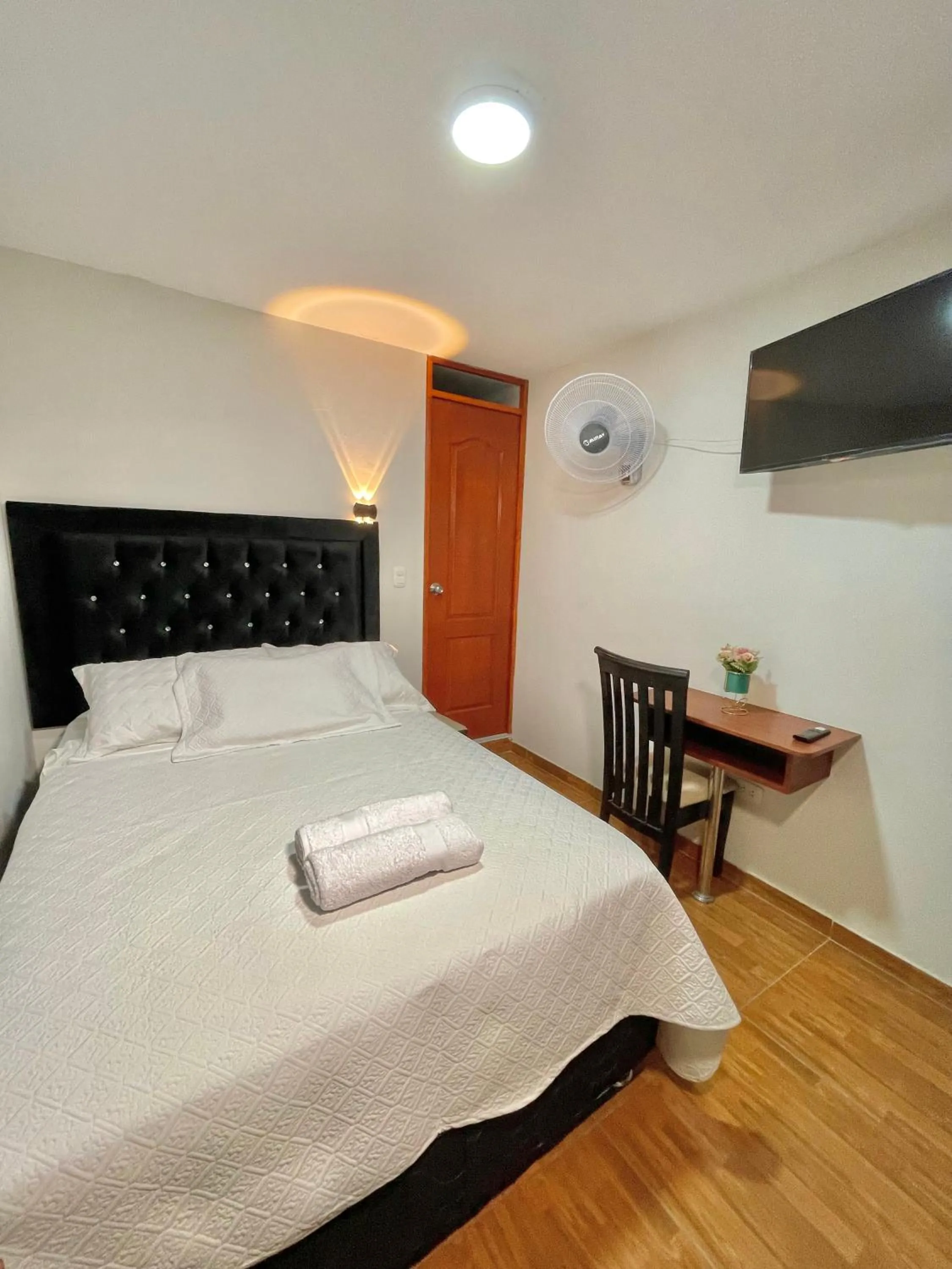 Bed in Jultom Inn Hotel & Suites