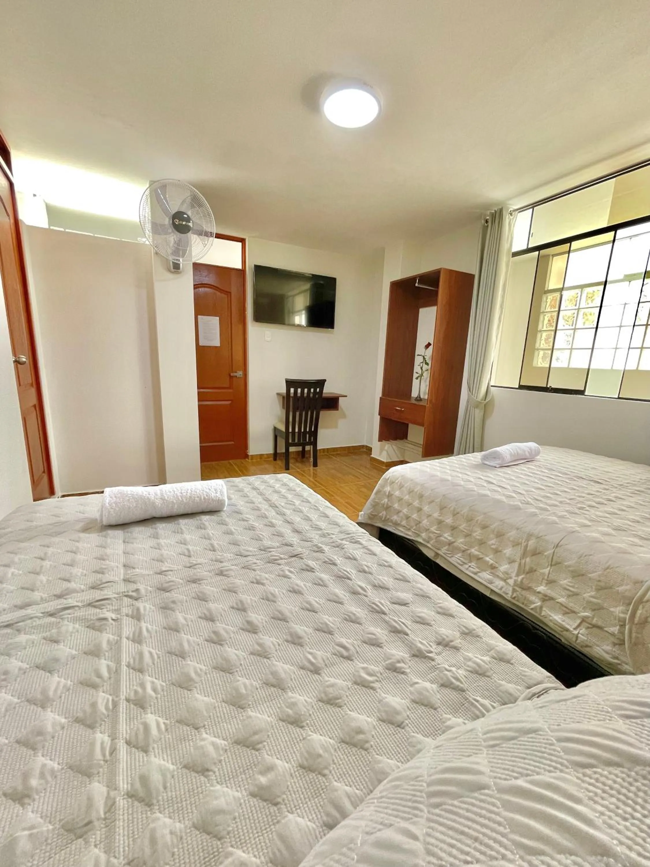 Bed in Jultom Inn Hotel & Suites