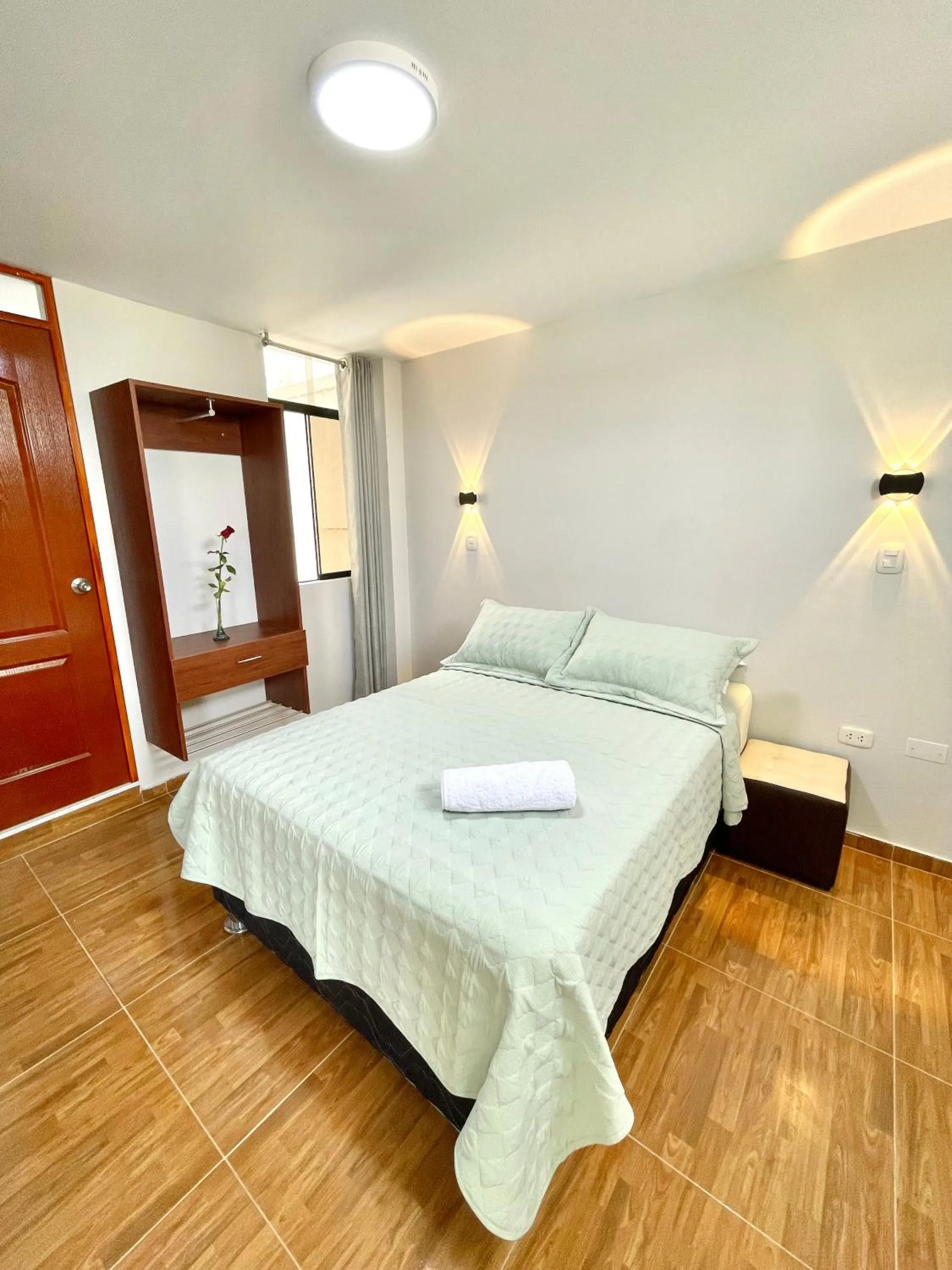 Bed in Jultom Inn Hotel & Suites