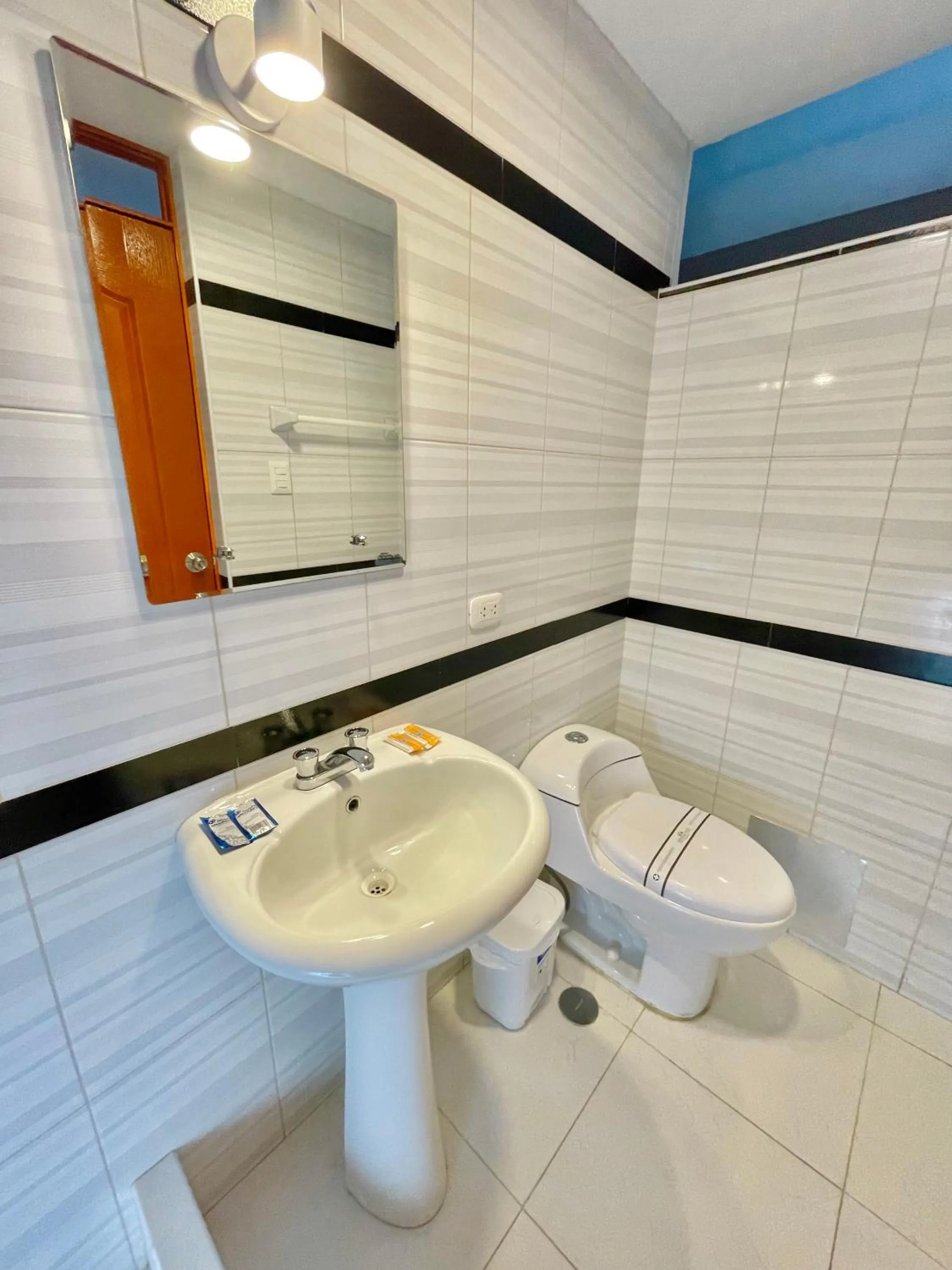 Toilet in Jultom Inn Hotel & Suites