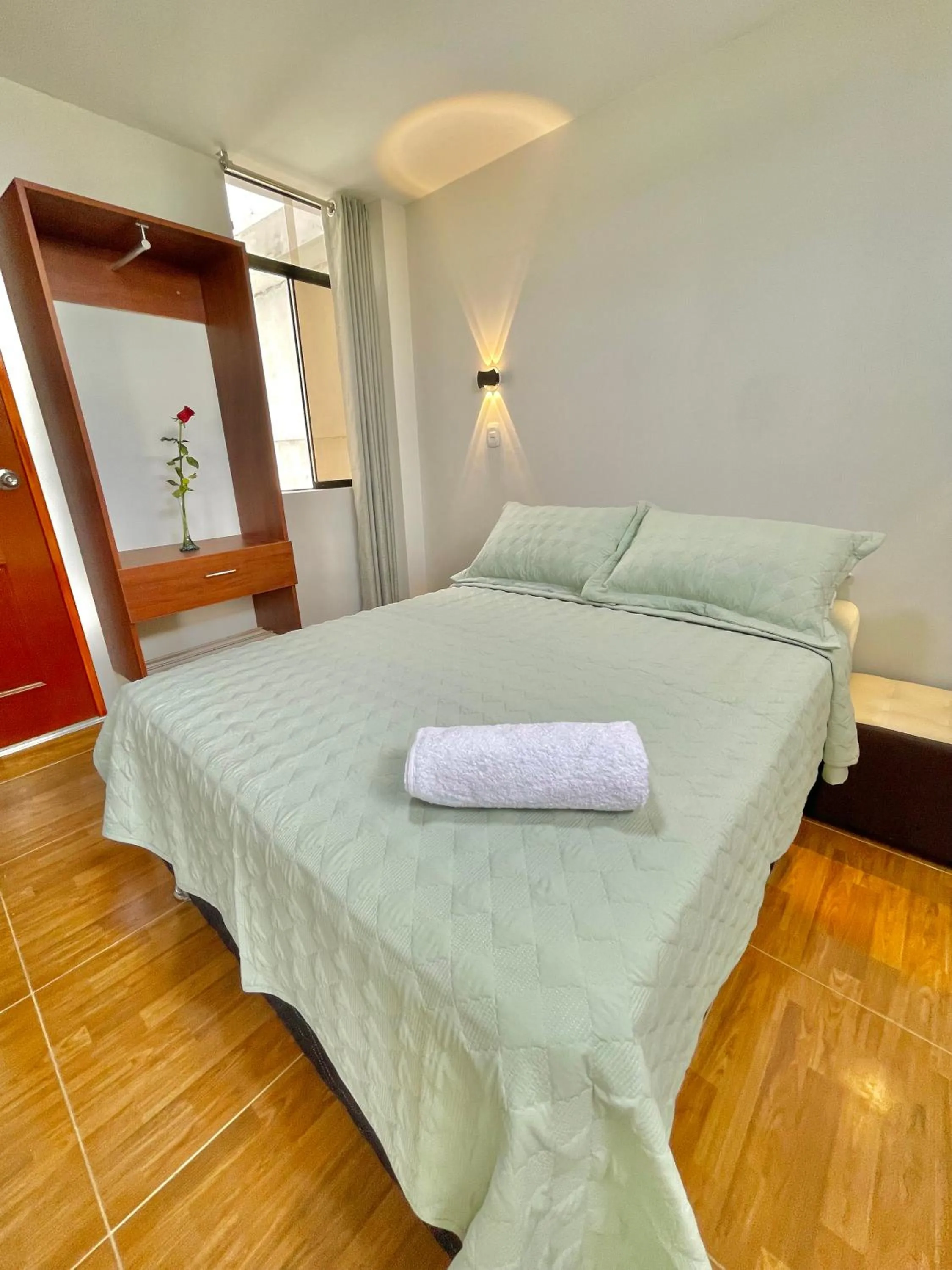 Bed in Jultom Inn Hotel & Suites