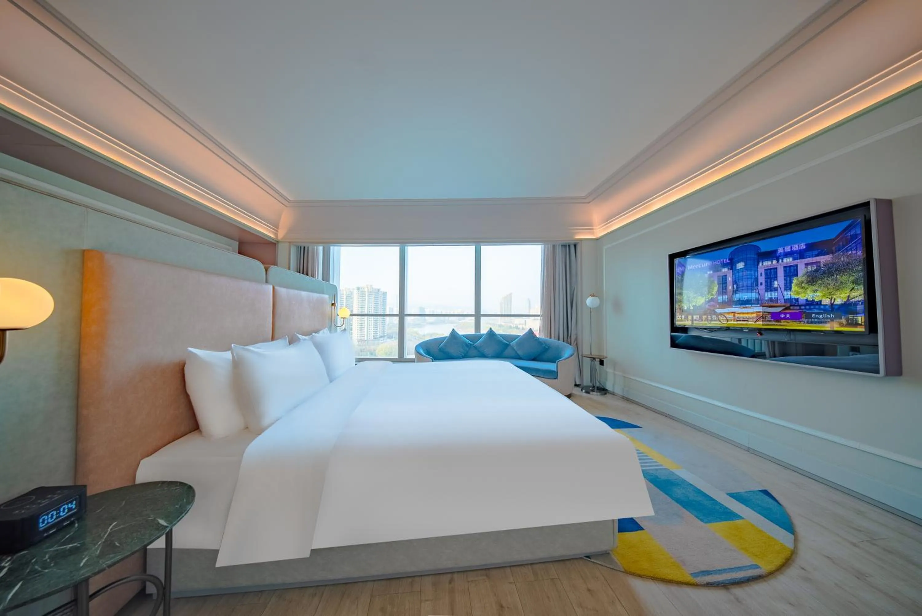 Communal lounge/ TV room, Bed in Mercure Lanzhou Downtown