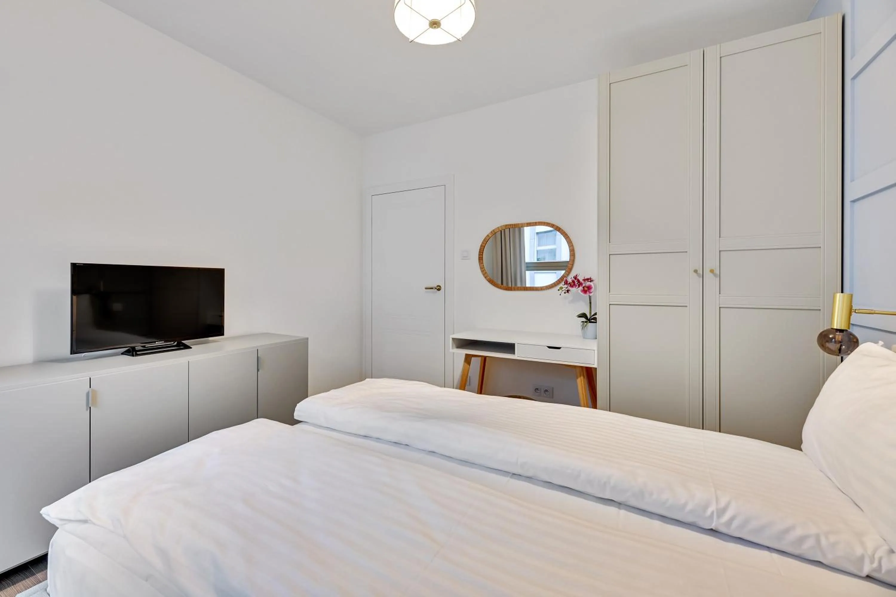 Bed in GRANO APARTMENTS Gdańsk Residence SPA & Wellness - GRANO APARTMENTS Gdańsk Old Town SPA & Wellness