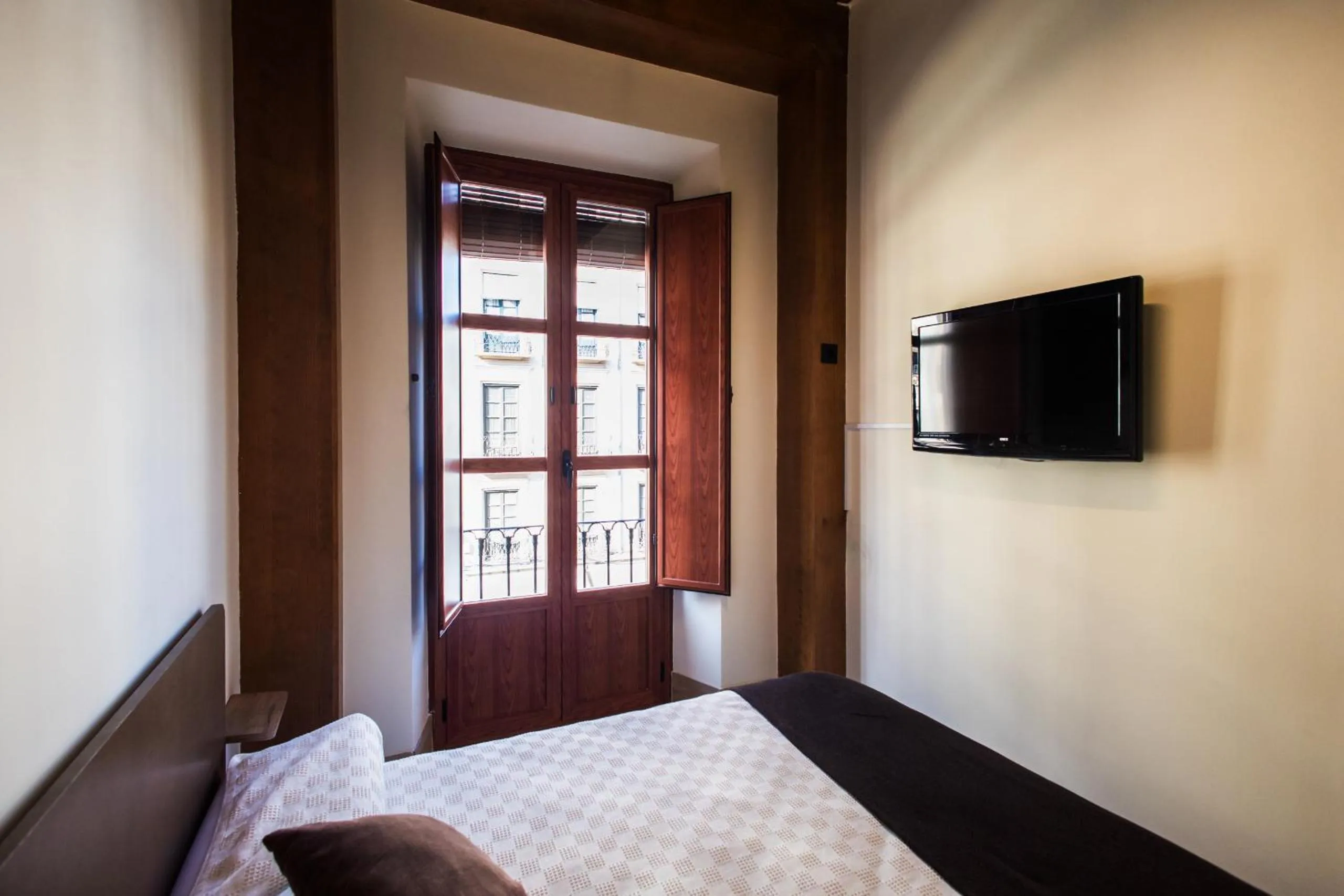 Bed in Apartamentos Reyes Católicos