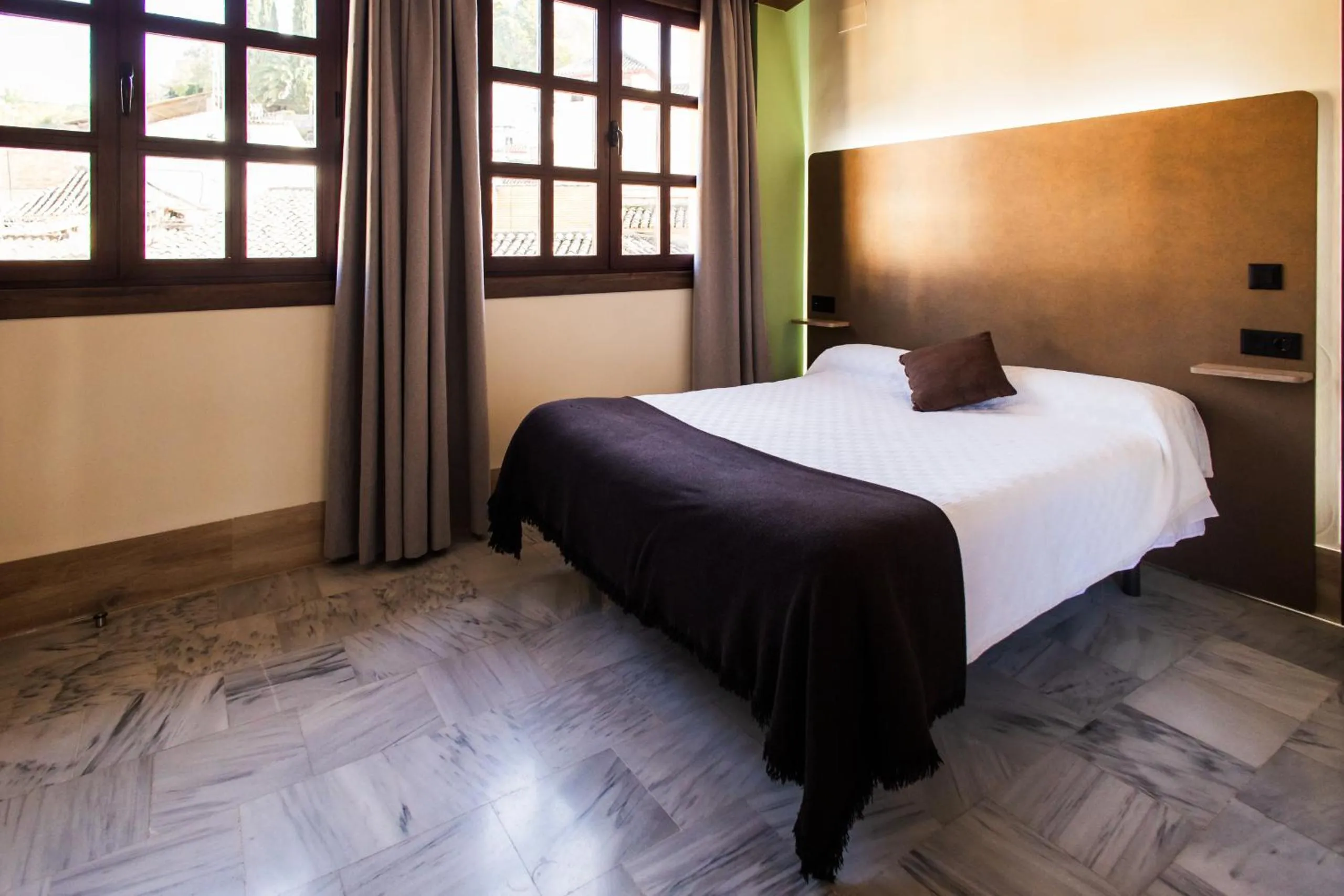 Bed in Apartamentos Reyes Católicos