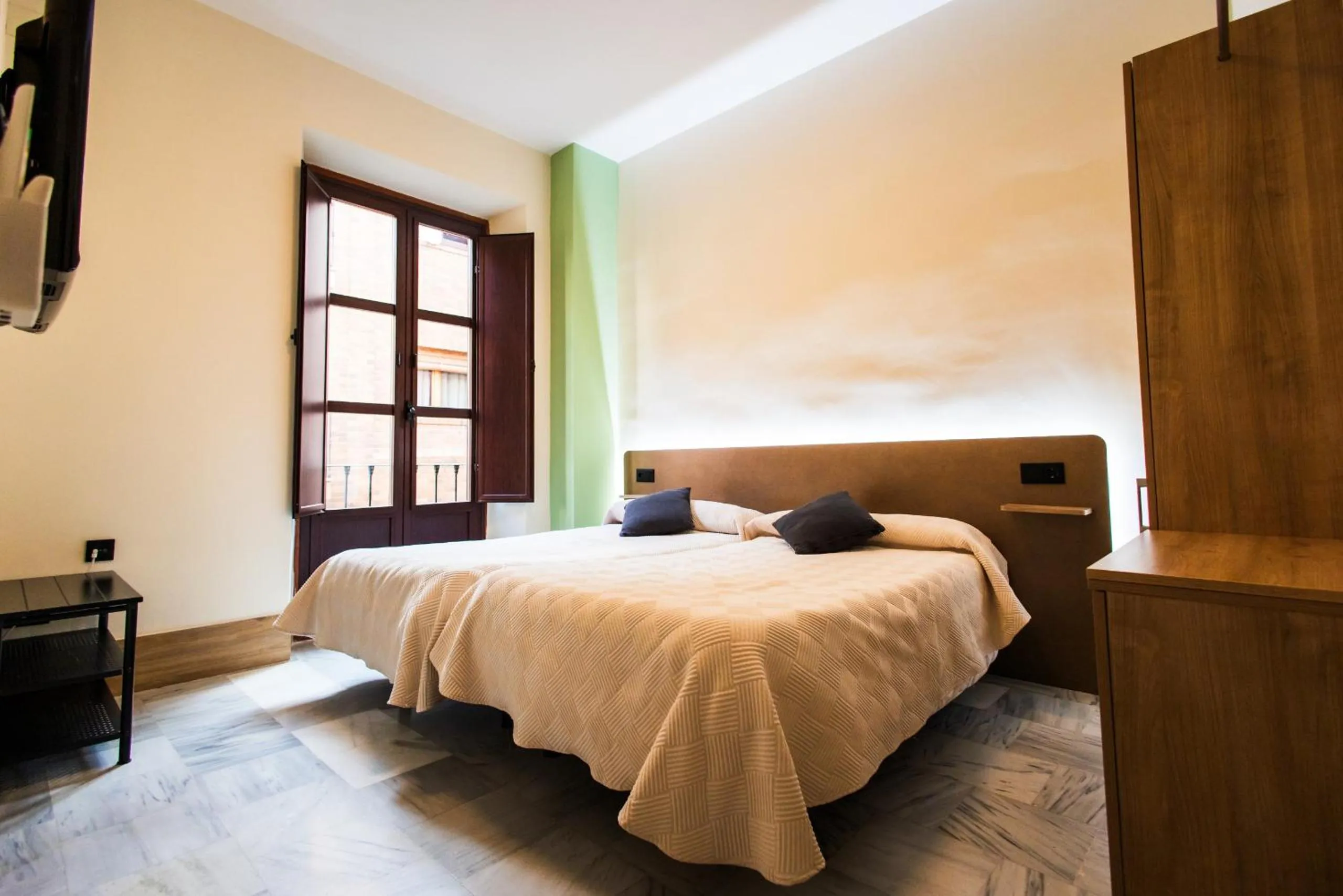 Bed in Apartamentos Reyes Católicos