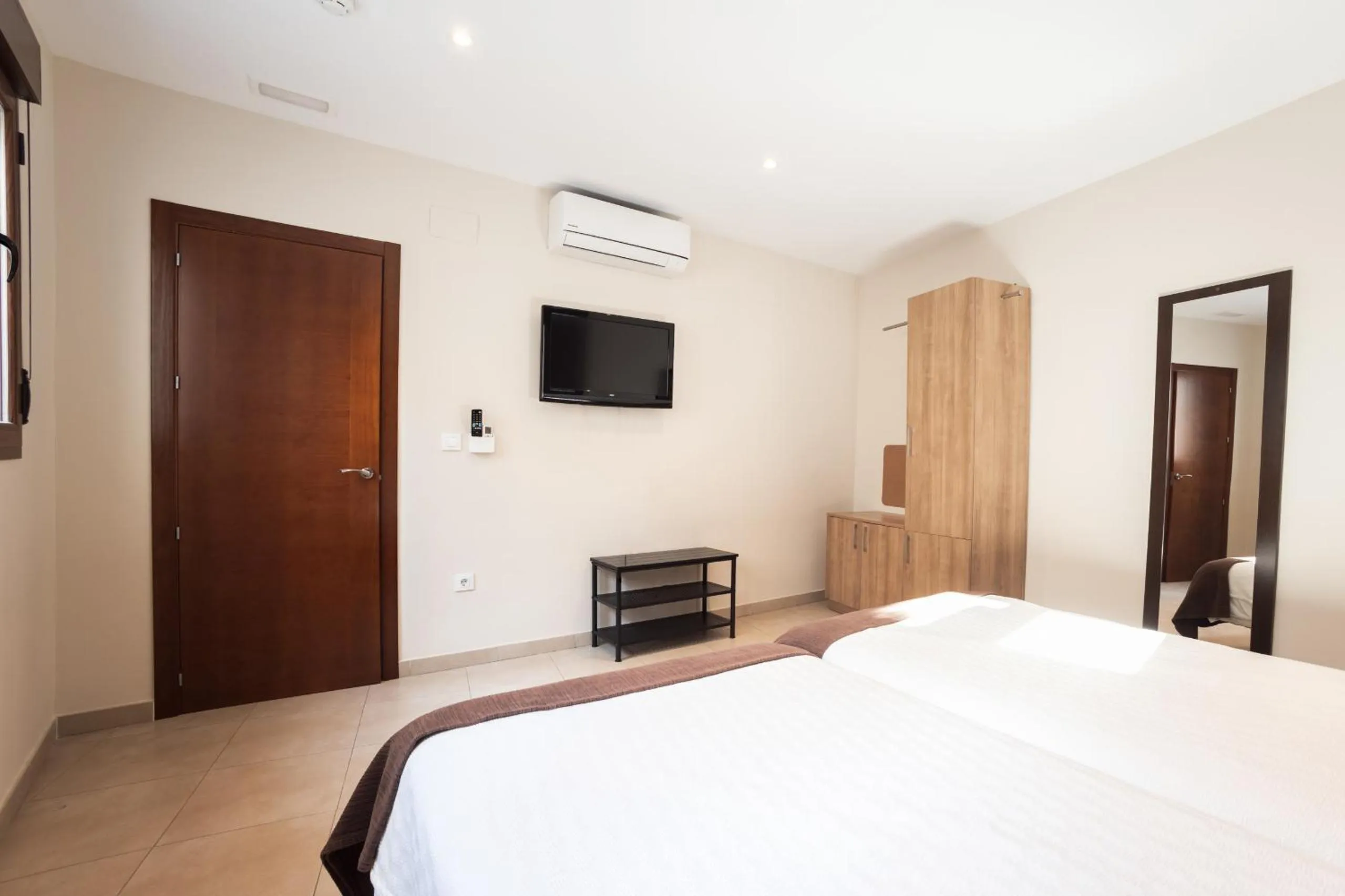 Bed in Apartamentos Reyes Católicos