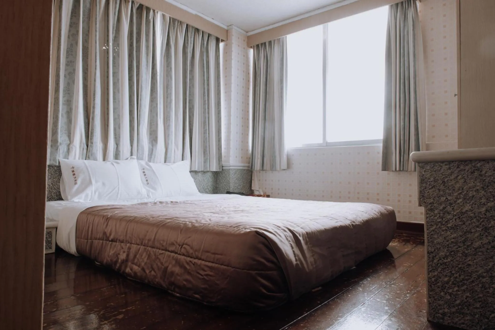 Bed in Tong Hsin Hotel