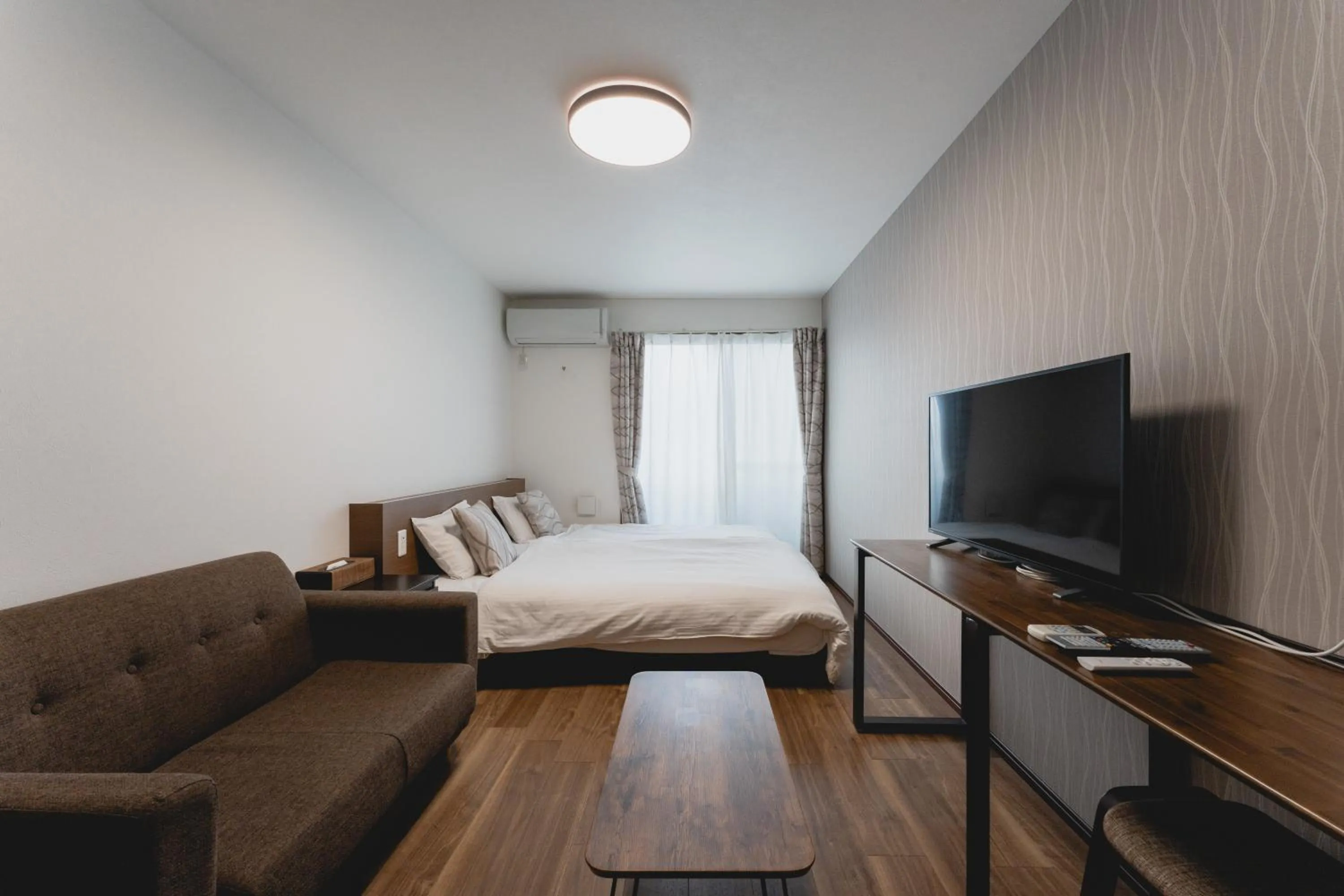 Bed in Apartment Hotel KANSO