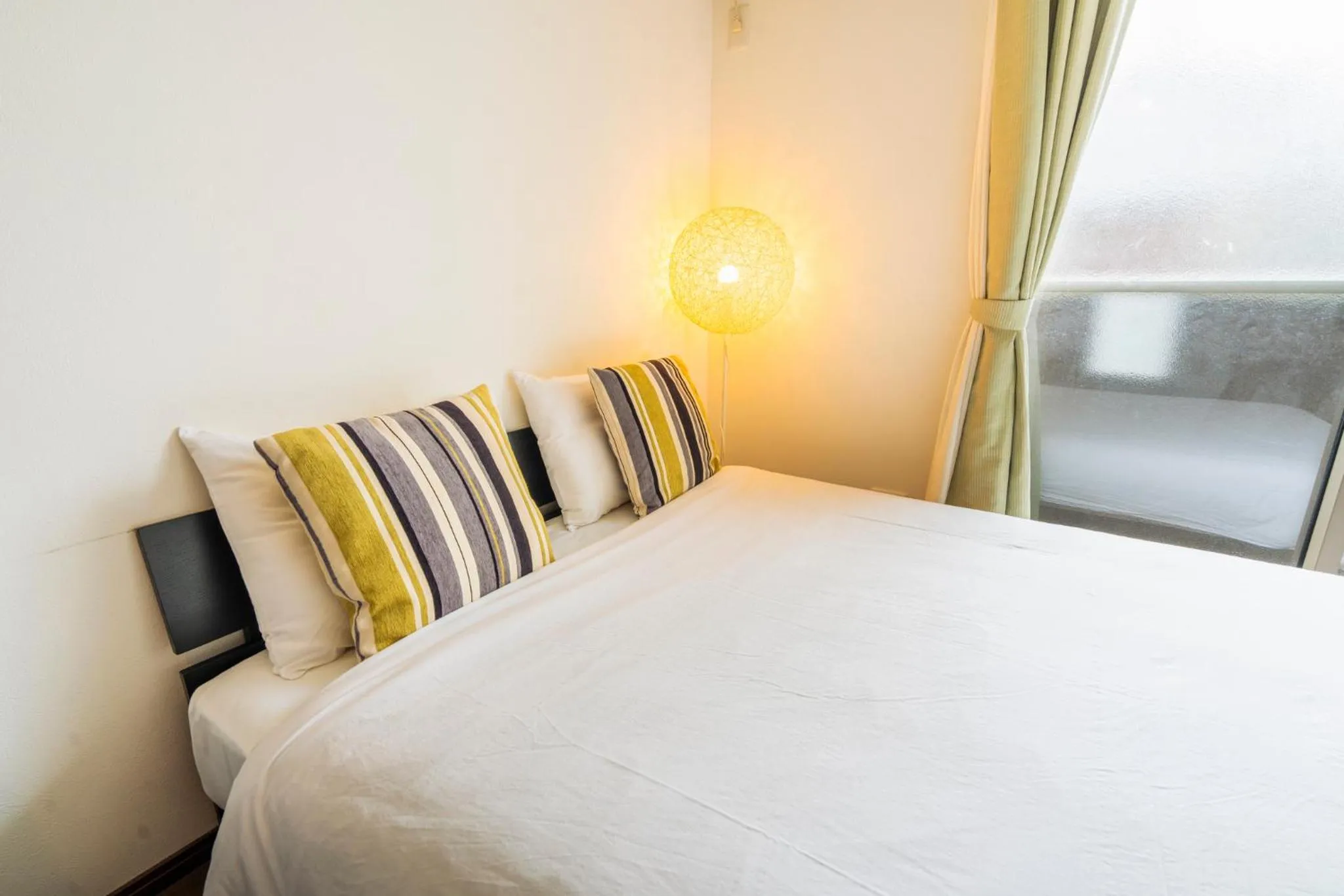 Bed in Apartment Hotel KANSO