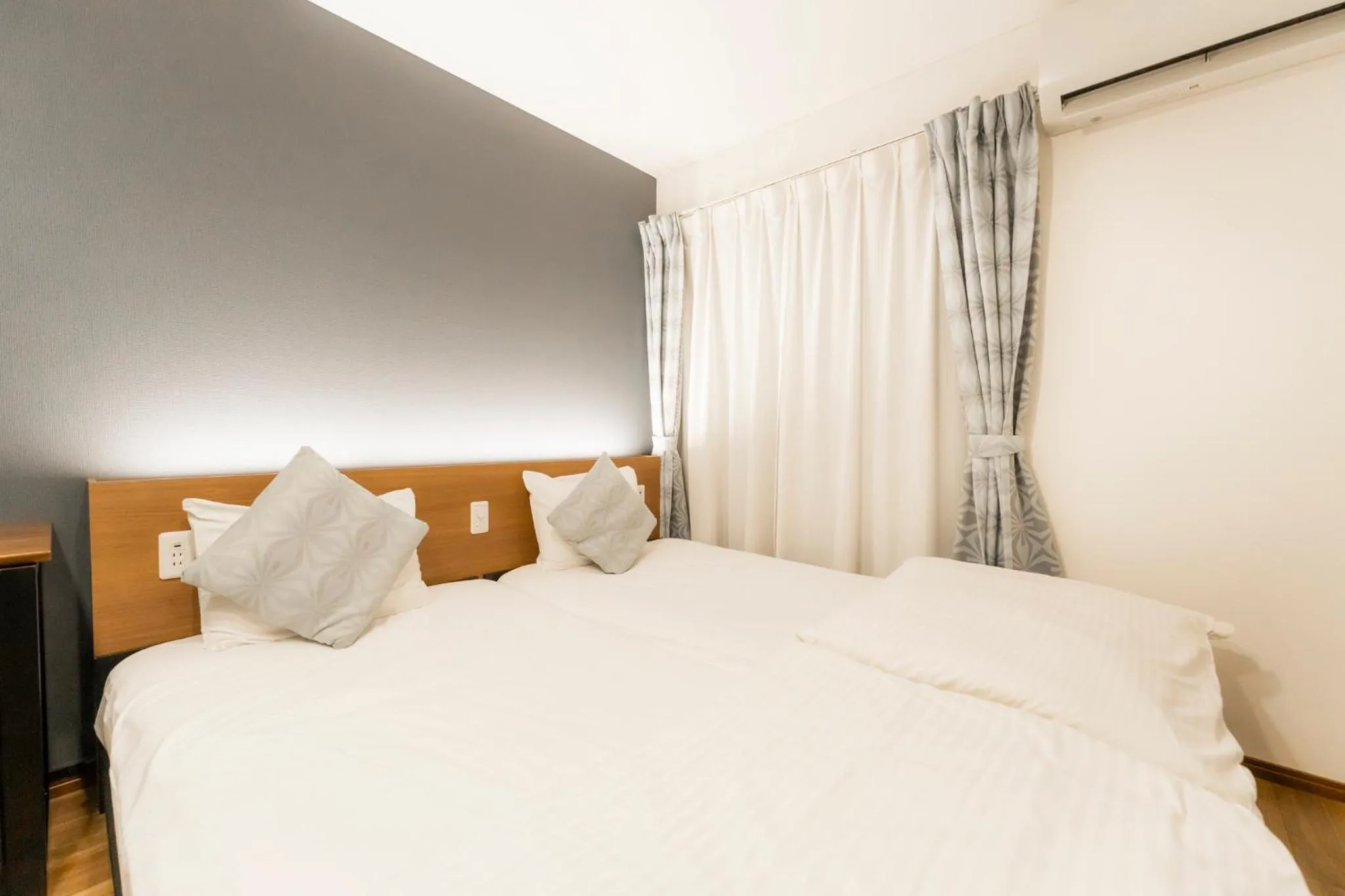 Bed in Apartment Hotel KANSO