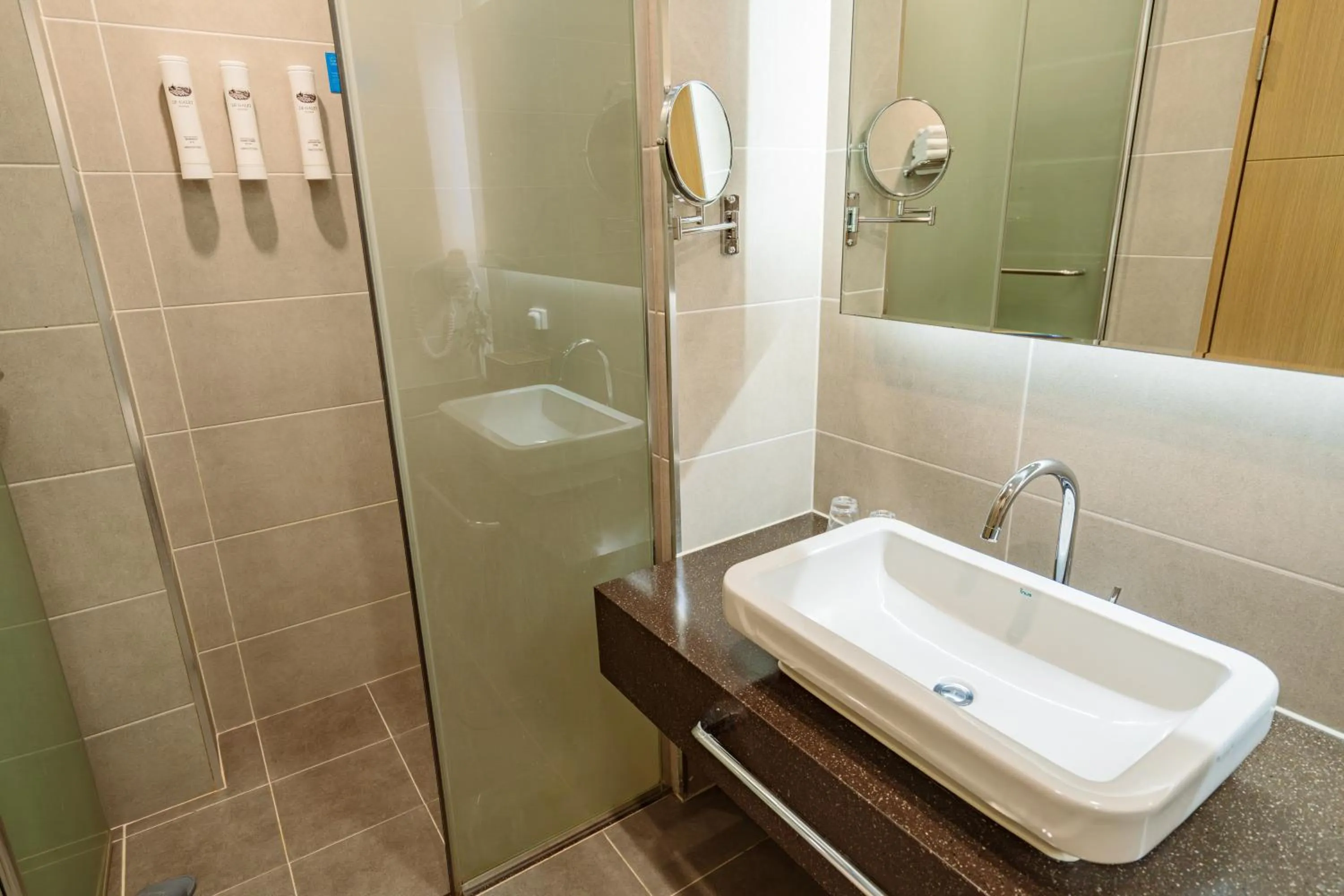 Toilet in Ramada Plaza by Wyndham Dolsan Yeosu