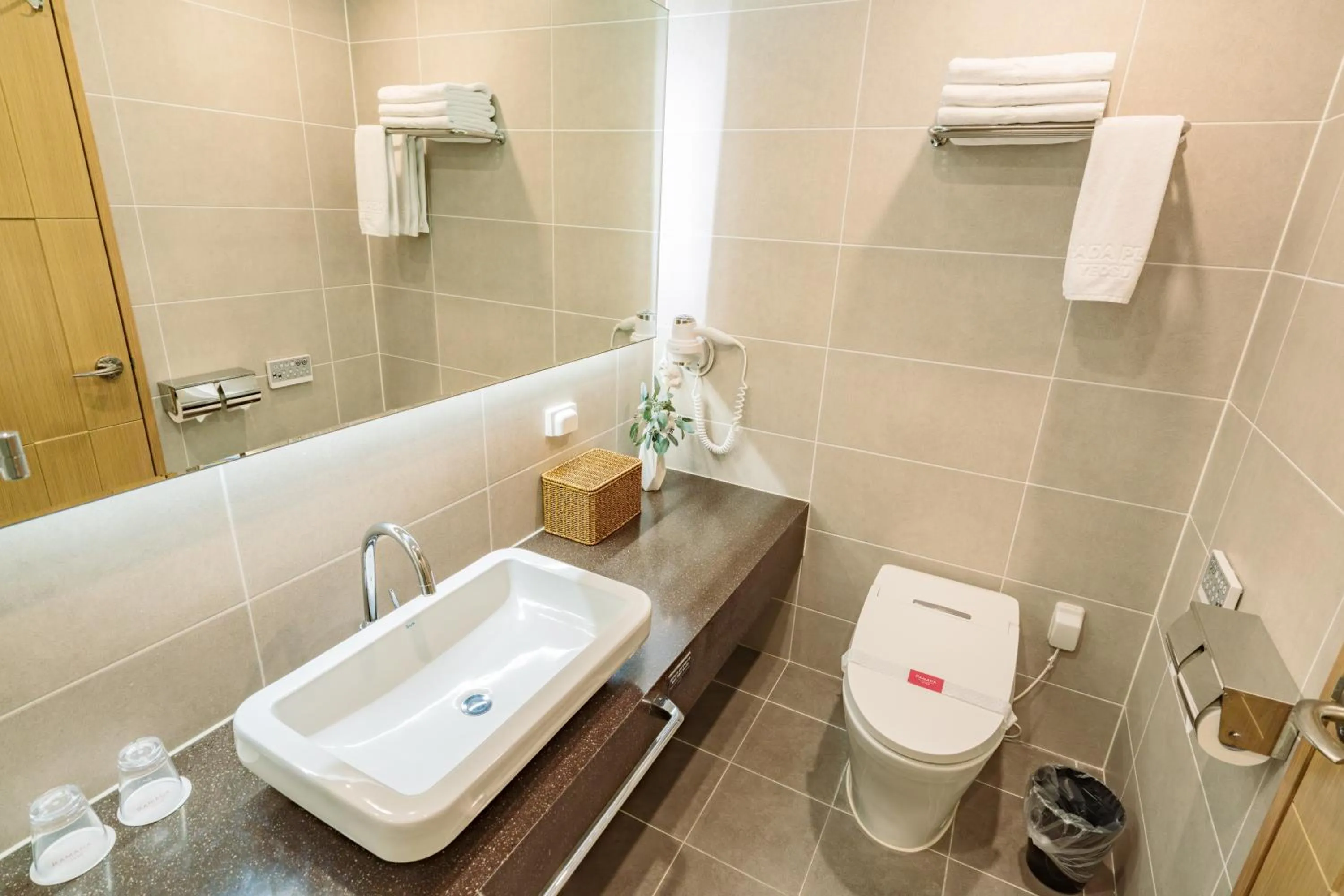 Toilet in Ramada Plaza by Wyndham Dolsan Yeosu