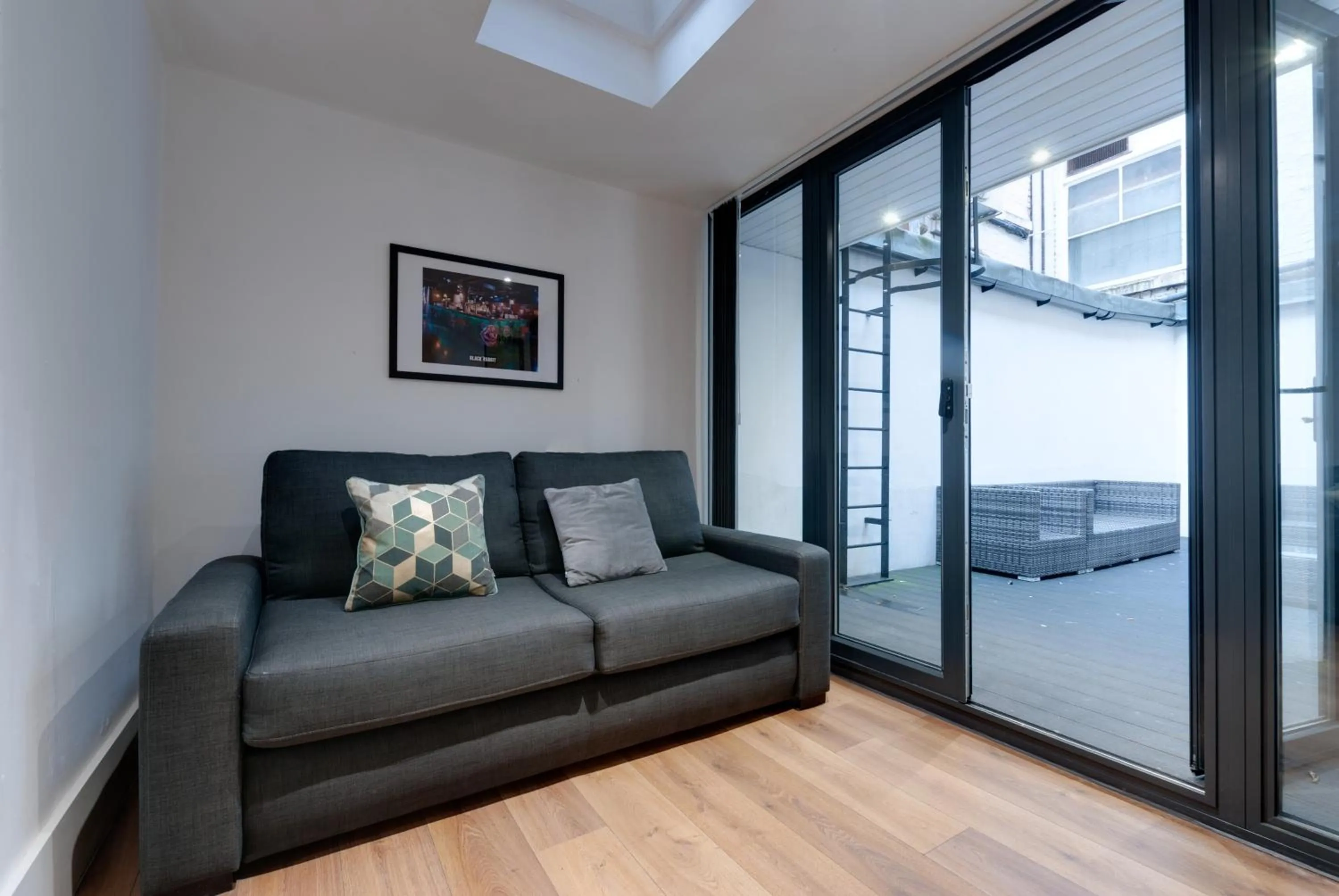Seating area in Lord Street Apartments By Happy Days