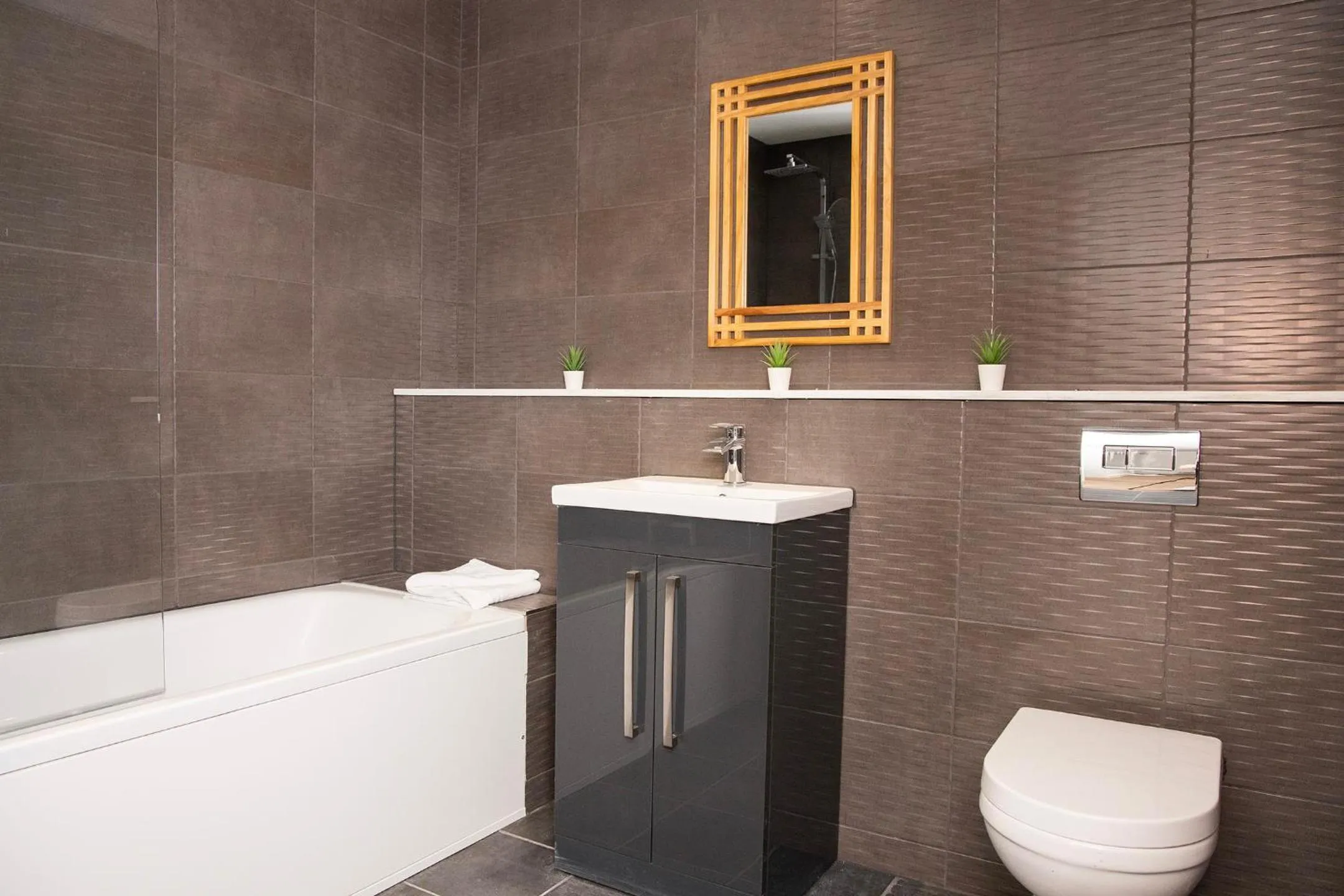 Bathroom in Lord Street Apartments By Happy Days