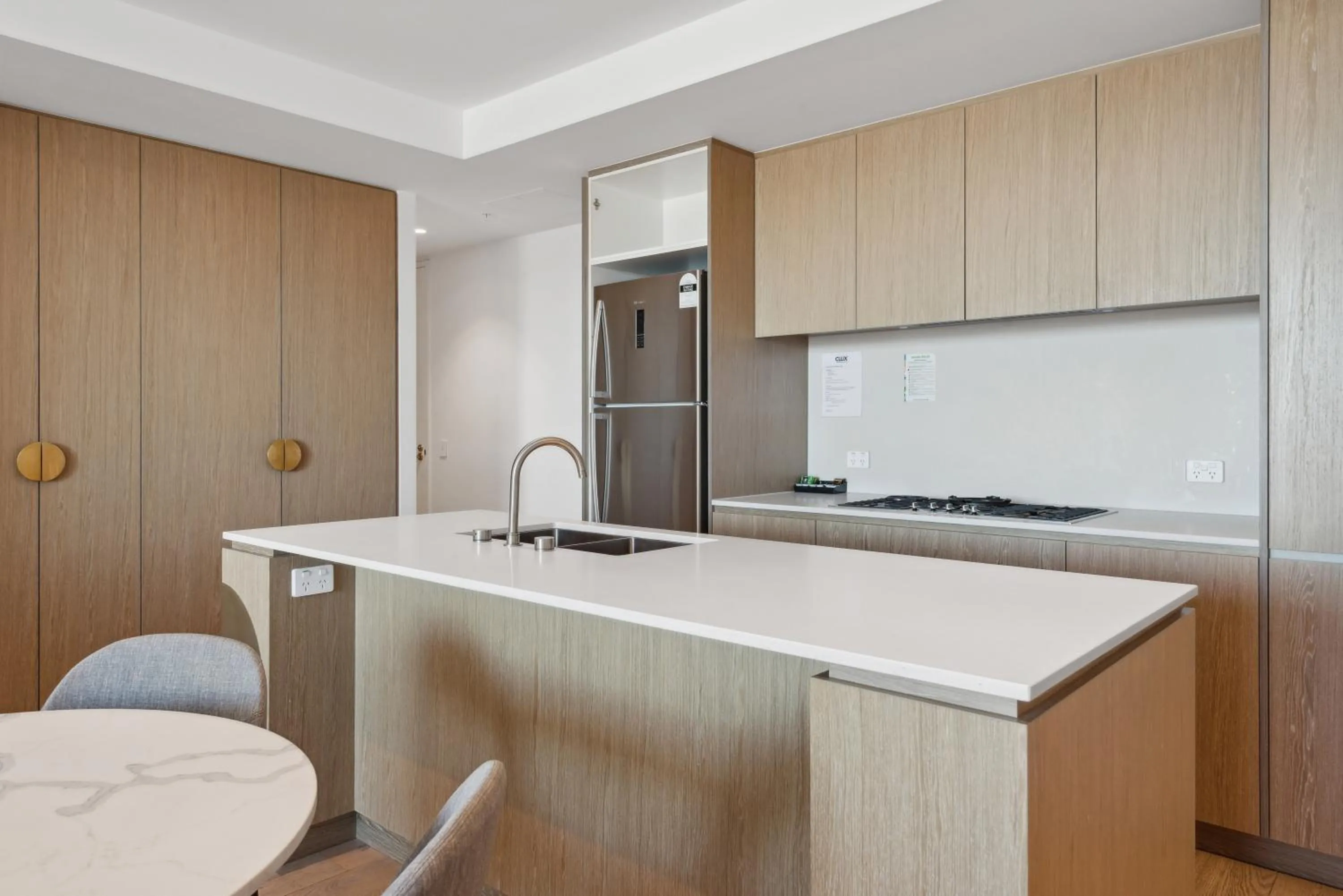 Kitchen or kitchenette in Realm Apartments by CLLIX