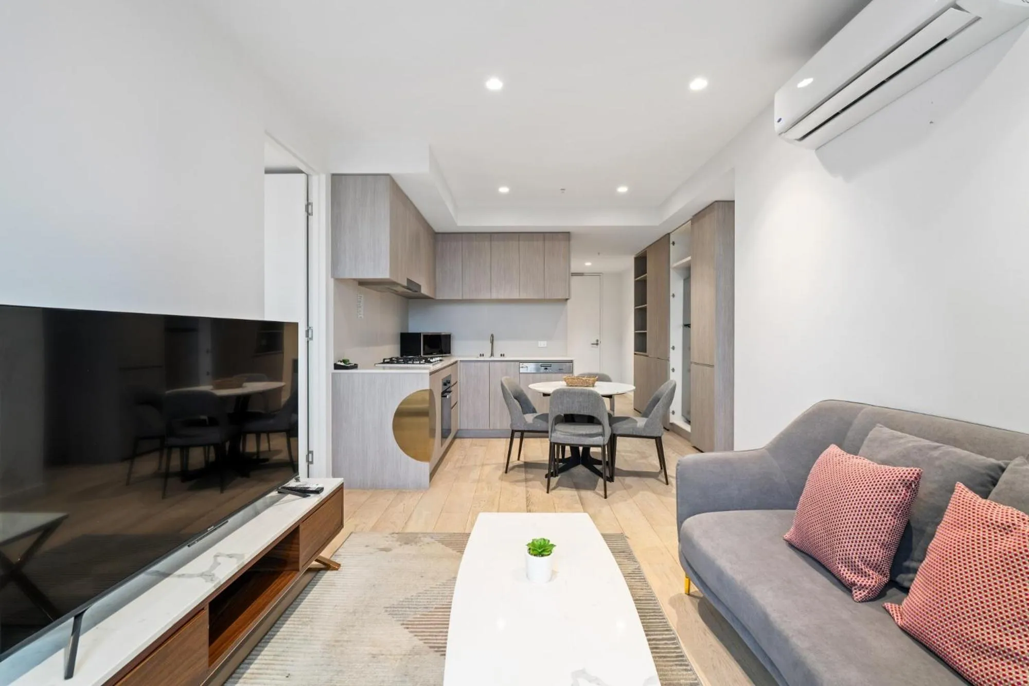 Living room in Realm Apartments by CLLIX