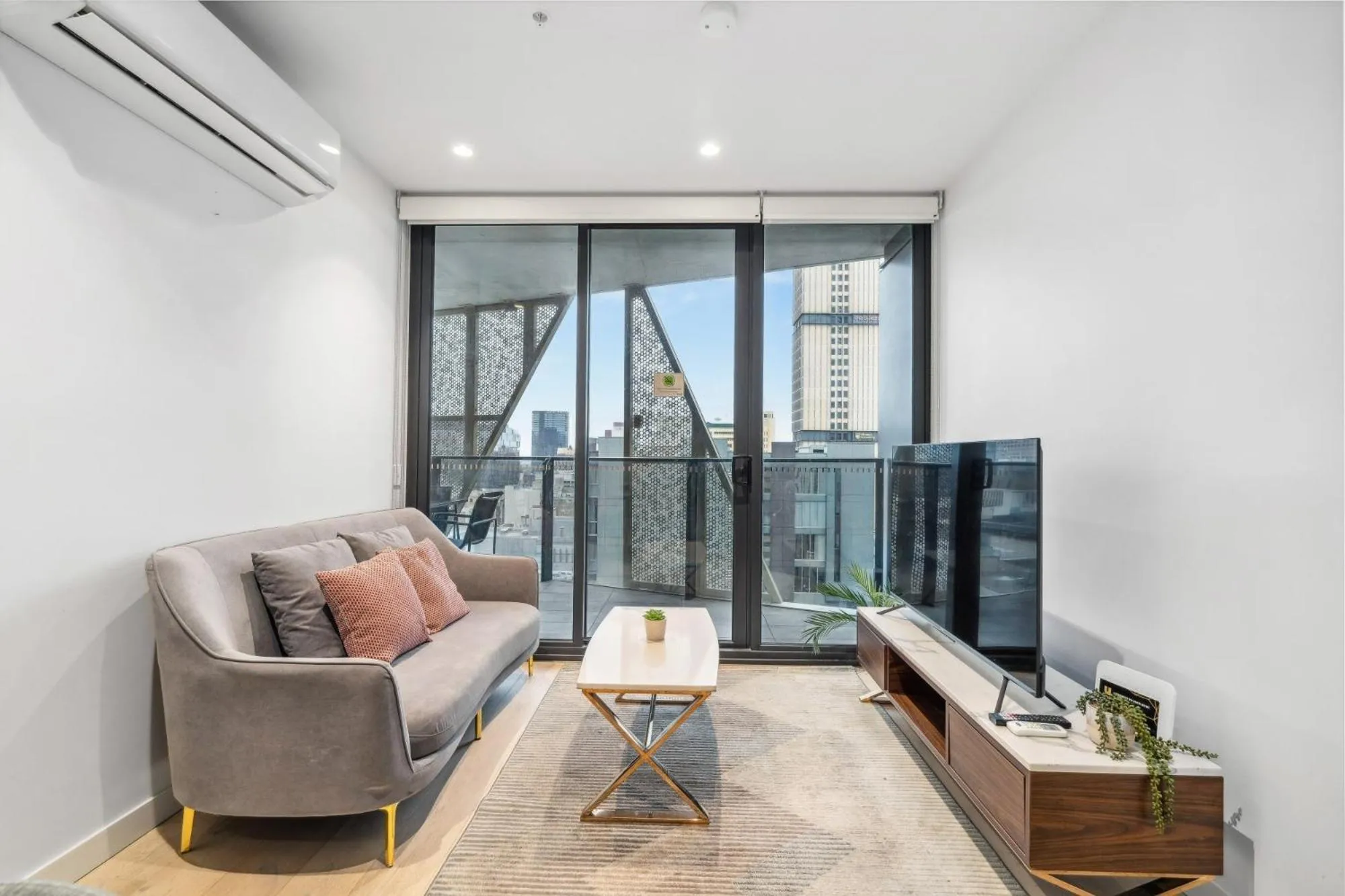 TV and multimedia in Realm Apartments by CLLIX