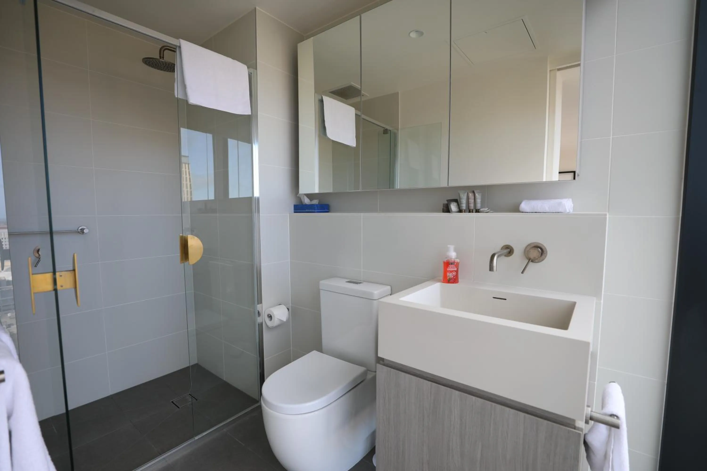 Shower in Realm Apartments by CLLIX