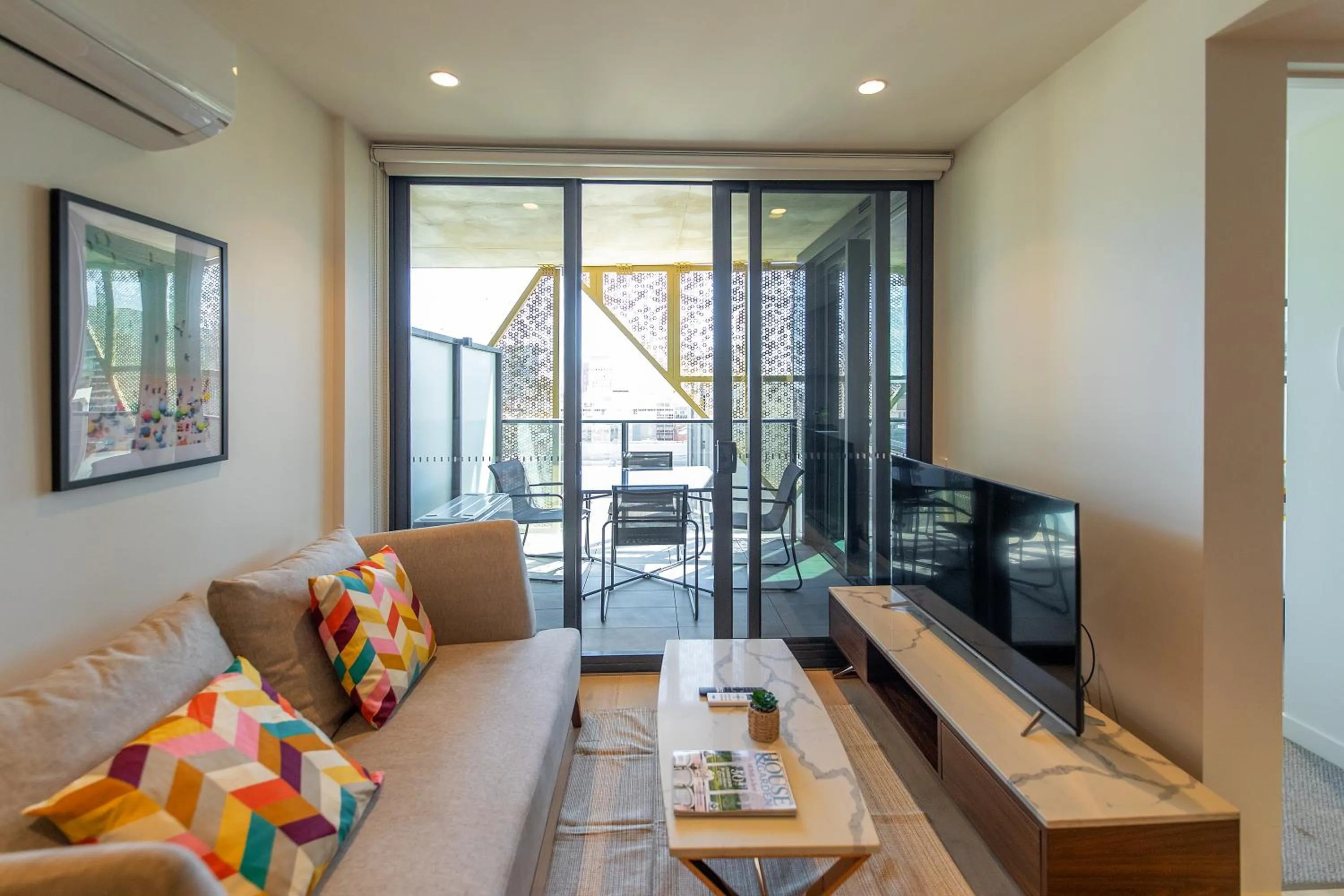 TV and multimedia in Realm Apartments by CLLIX