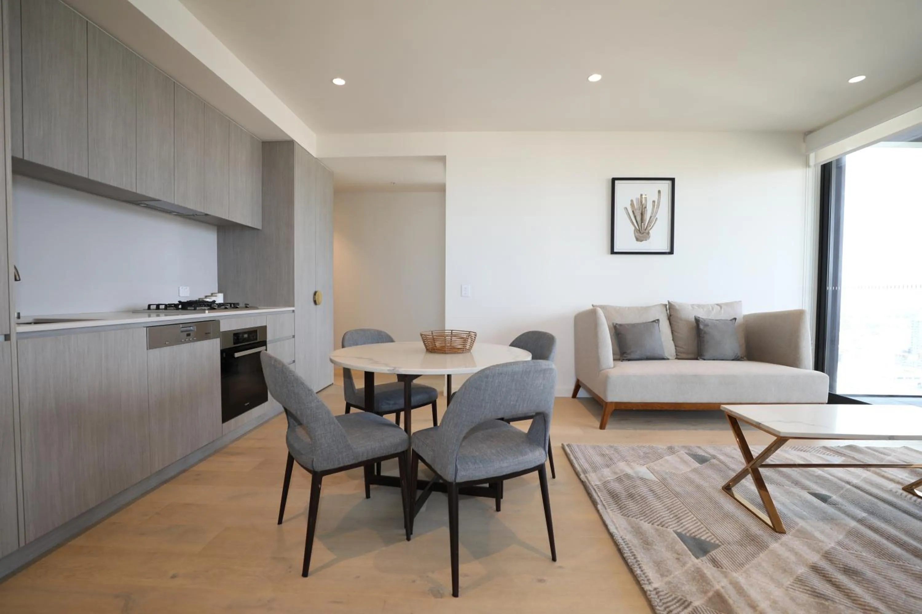 Kitchen or kitchenette in Realm Apartments by CLLIX