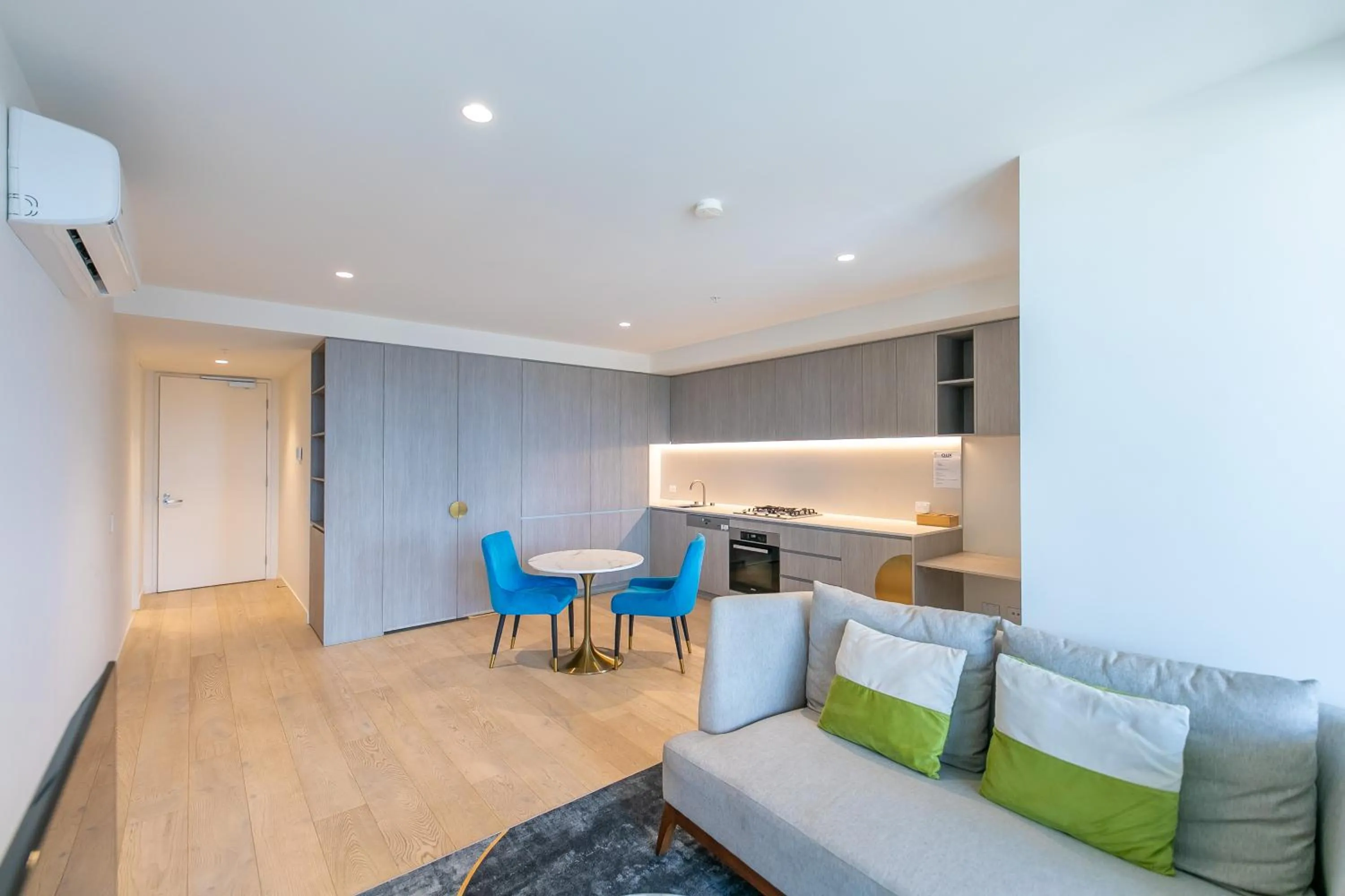 Living room in Realm Apartments by CLLIX