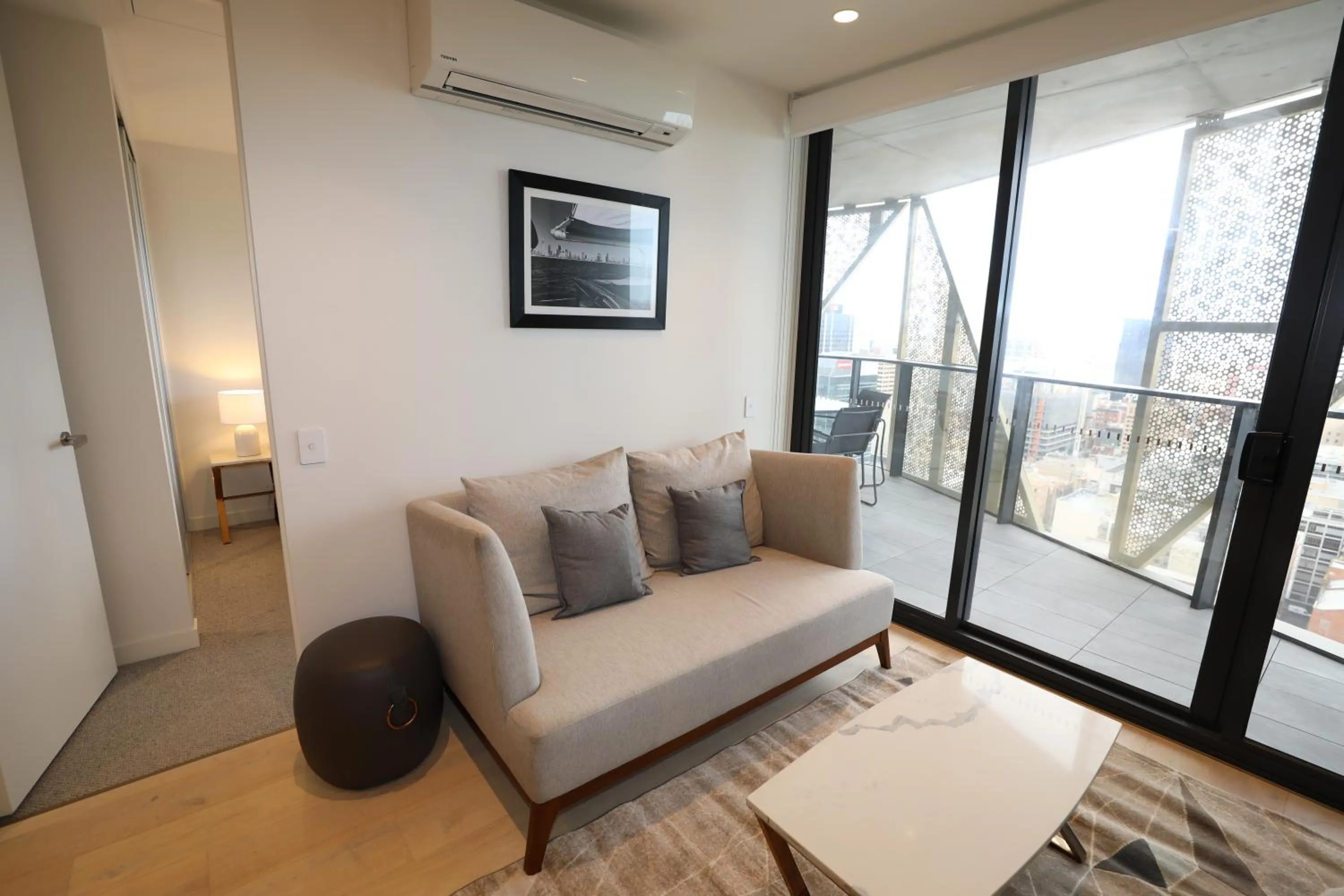 Living room in Realm Apartments by CLLIX