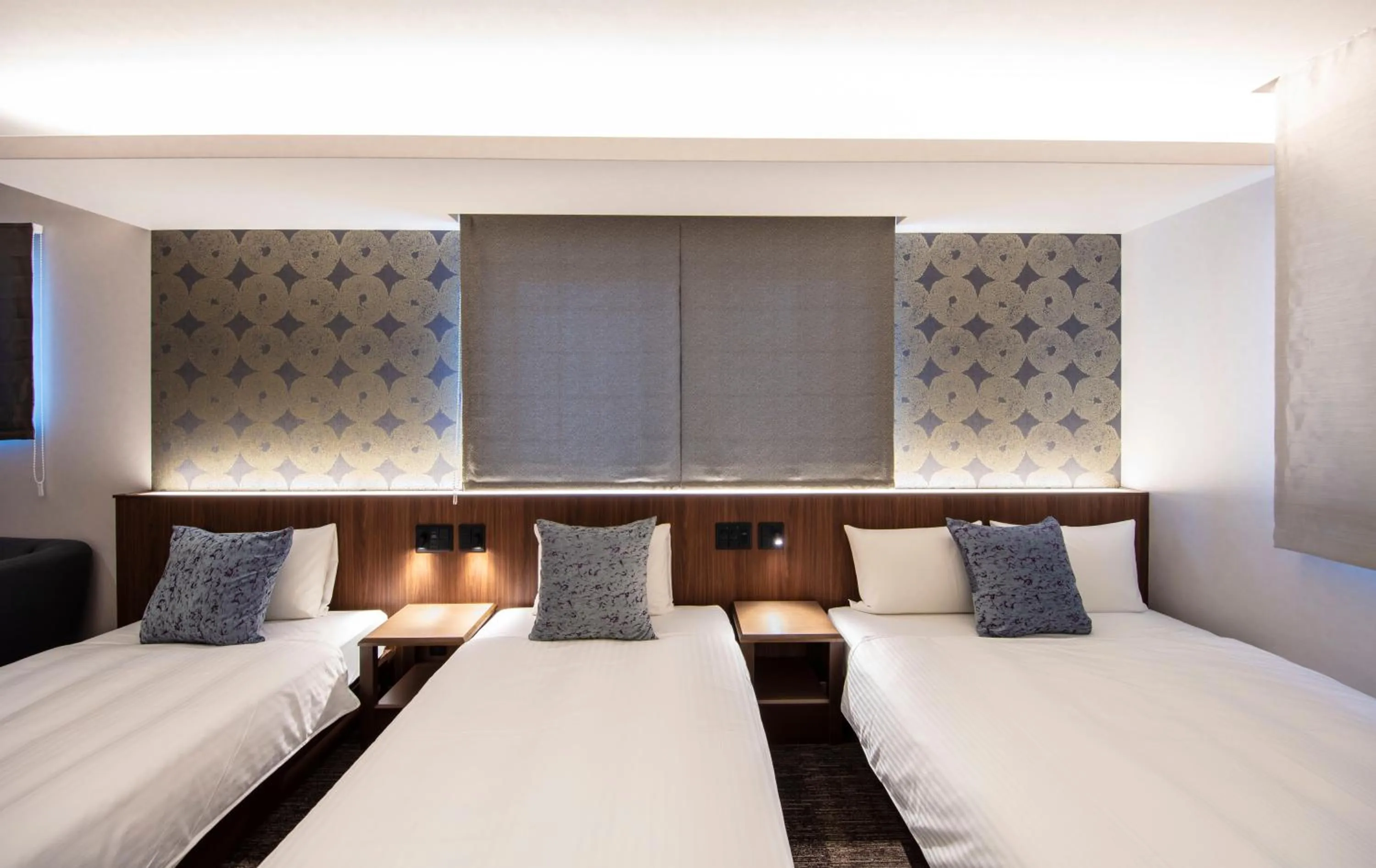 Bed in GRAND BASE Okayama Ekimae