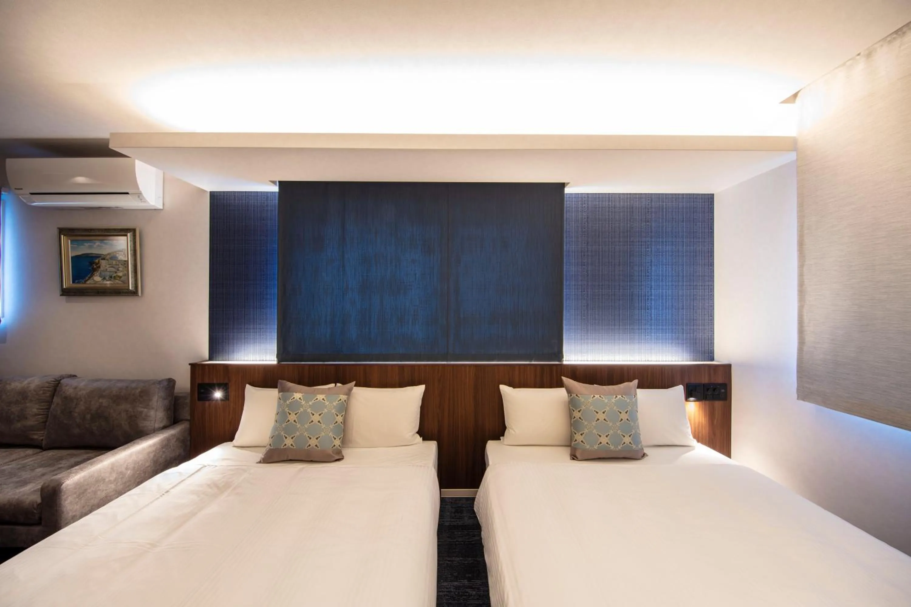 Bed in GRAND BASE Okayama Ekimae