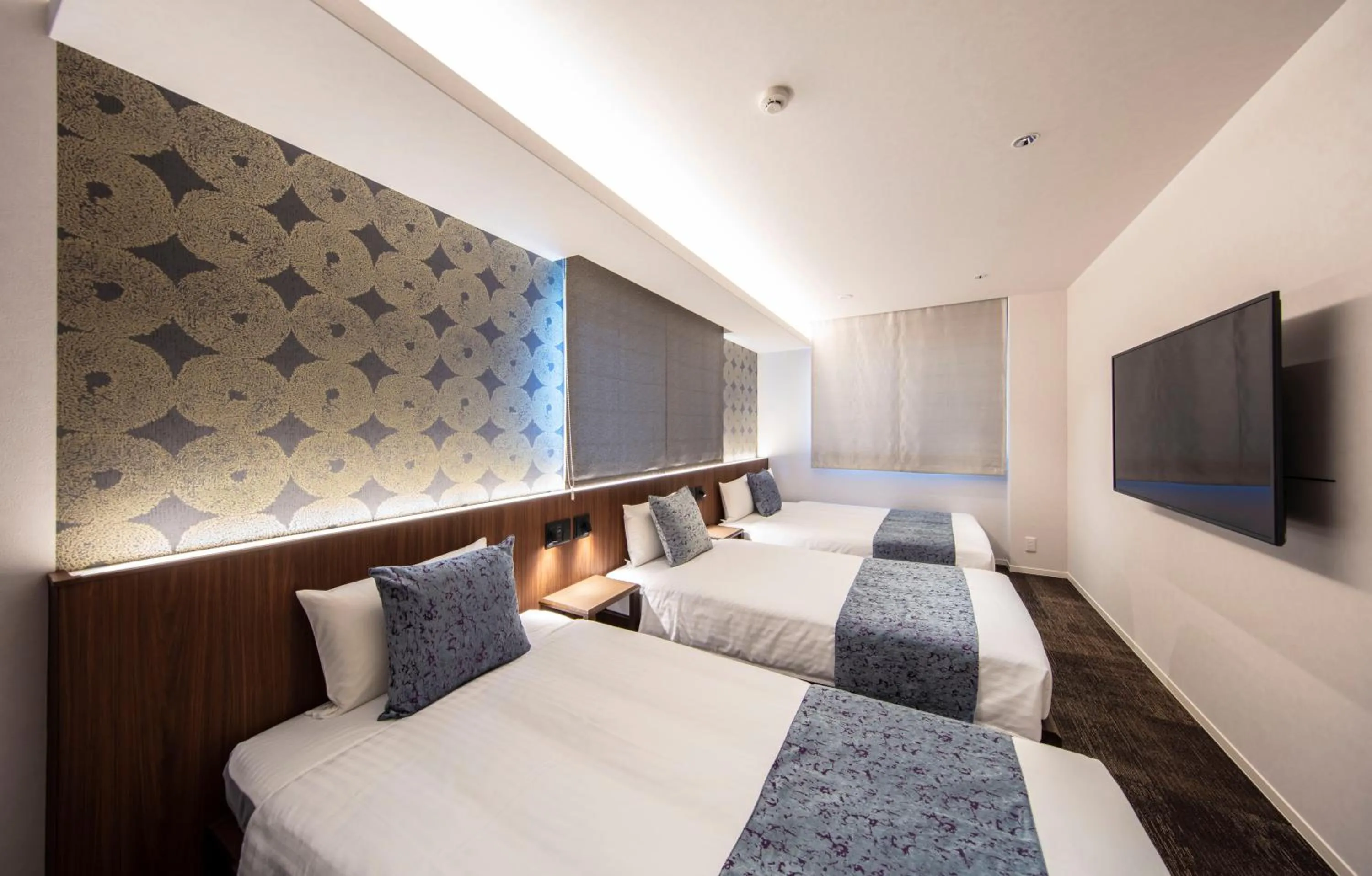 Bed in GRAND BASE Okayama Ekimae