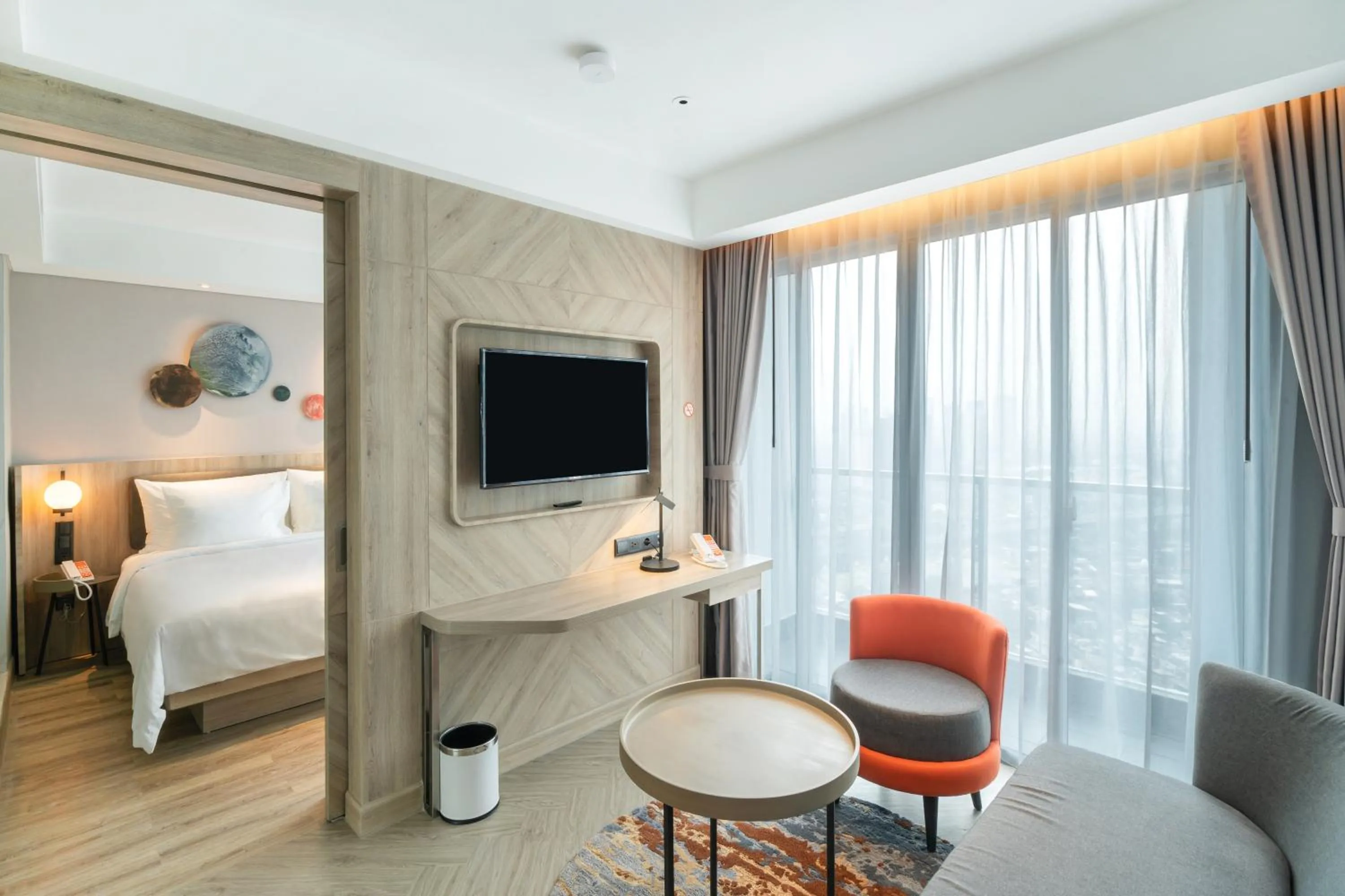 Living room, Bed in Harris Suites Puri Mansion