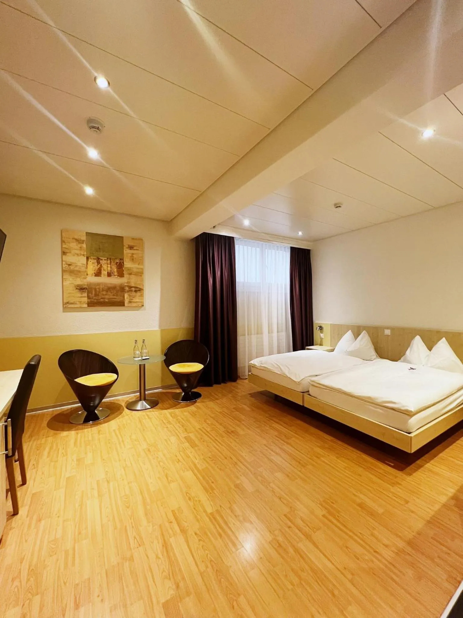 Living room, Bed in Sorell Hotel Sonnental Dübendorf