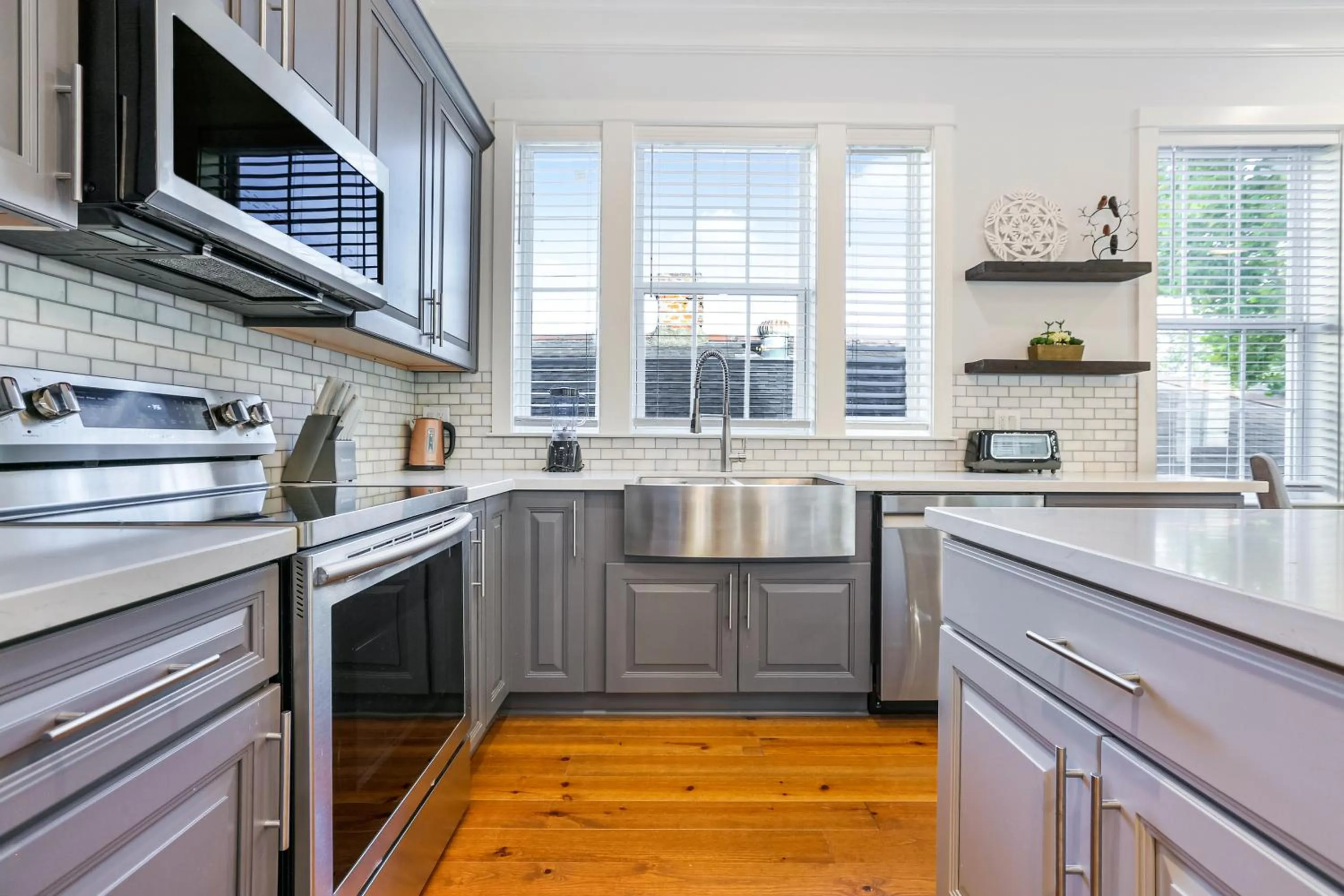 Kitchen or kitchenette in Hosteeva Chic Urban Retreat w Pool Steps to St Charles Ave and Near Bourbon St