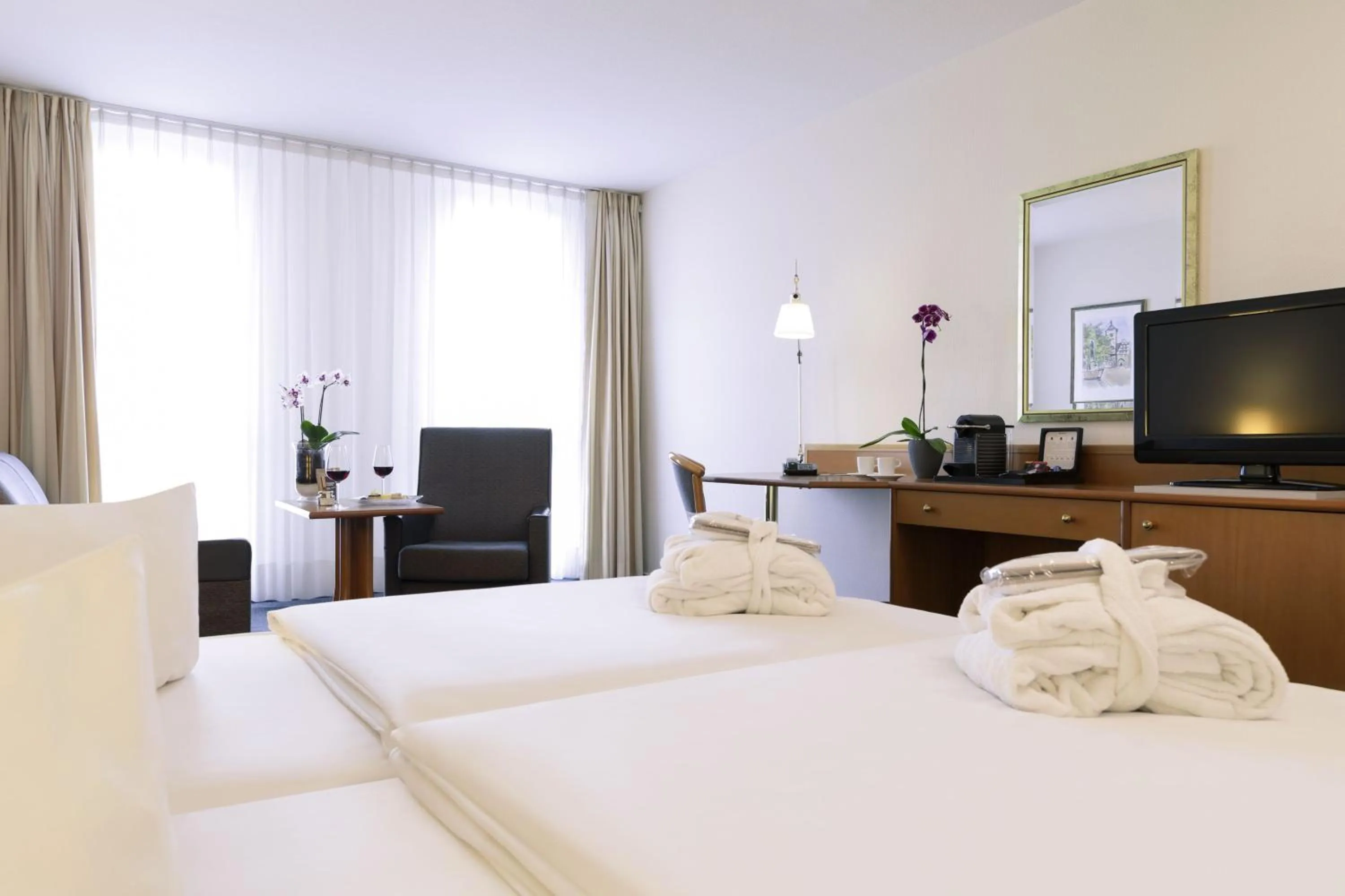 Photo of the whole room, Bed in Novotel Freiburg am Konzerthaus