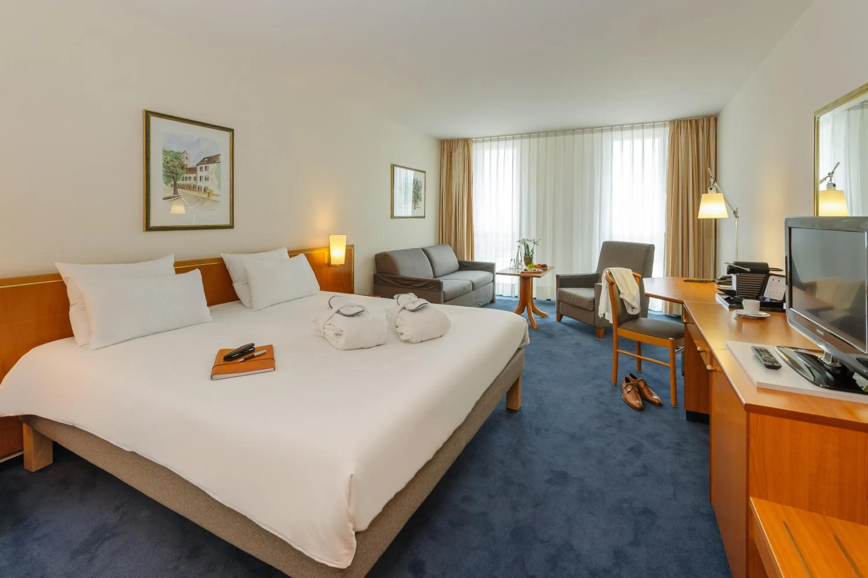 Photo of the whole room, Bed in Novotel Freiburg am Konzerthaus