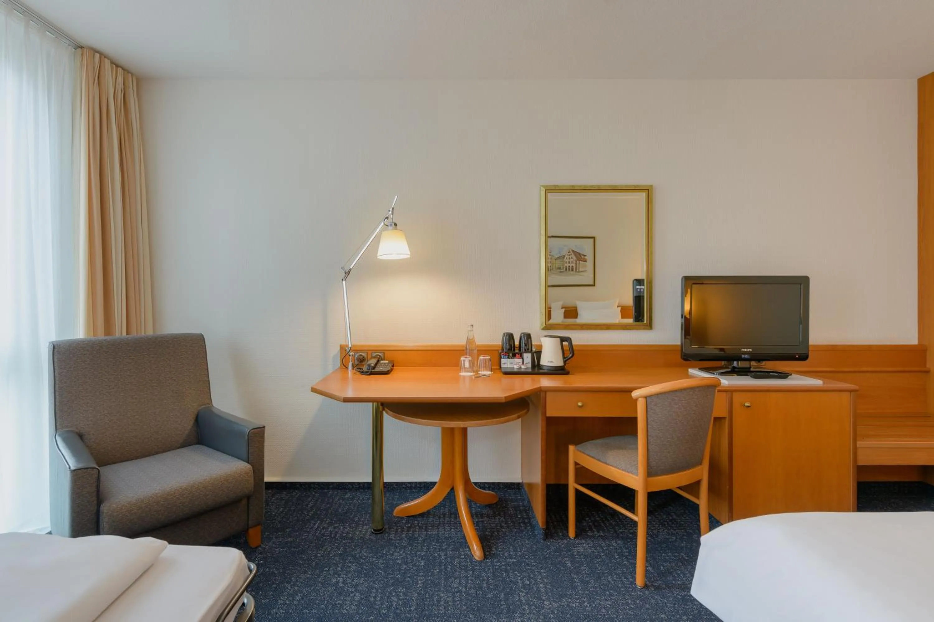 Photo of the whole room, Bed in Novotel Freiburg am Konzerthaus