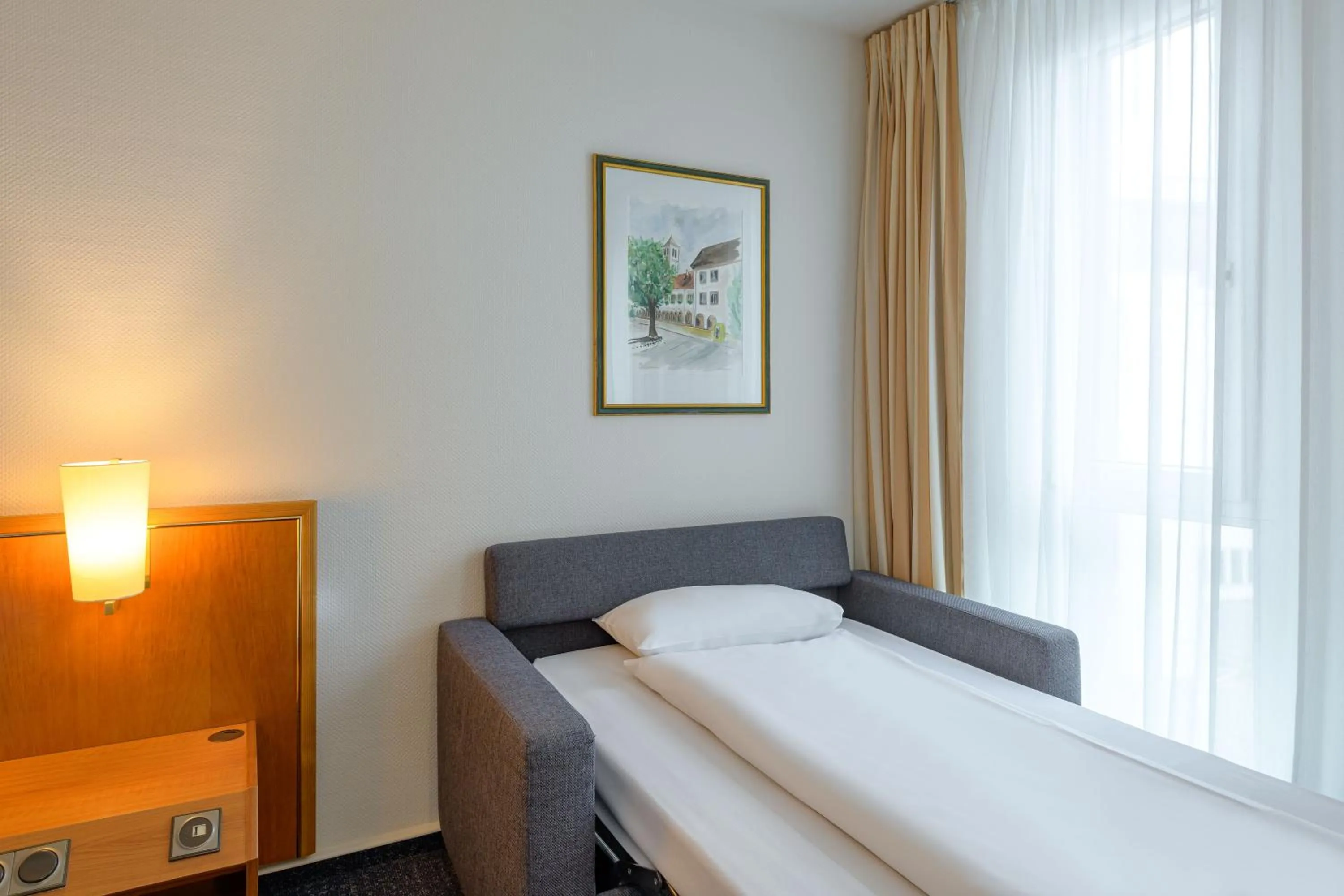 Photo of the whole room, Bed in Novotel Freiburg am Konzerthaus