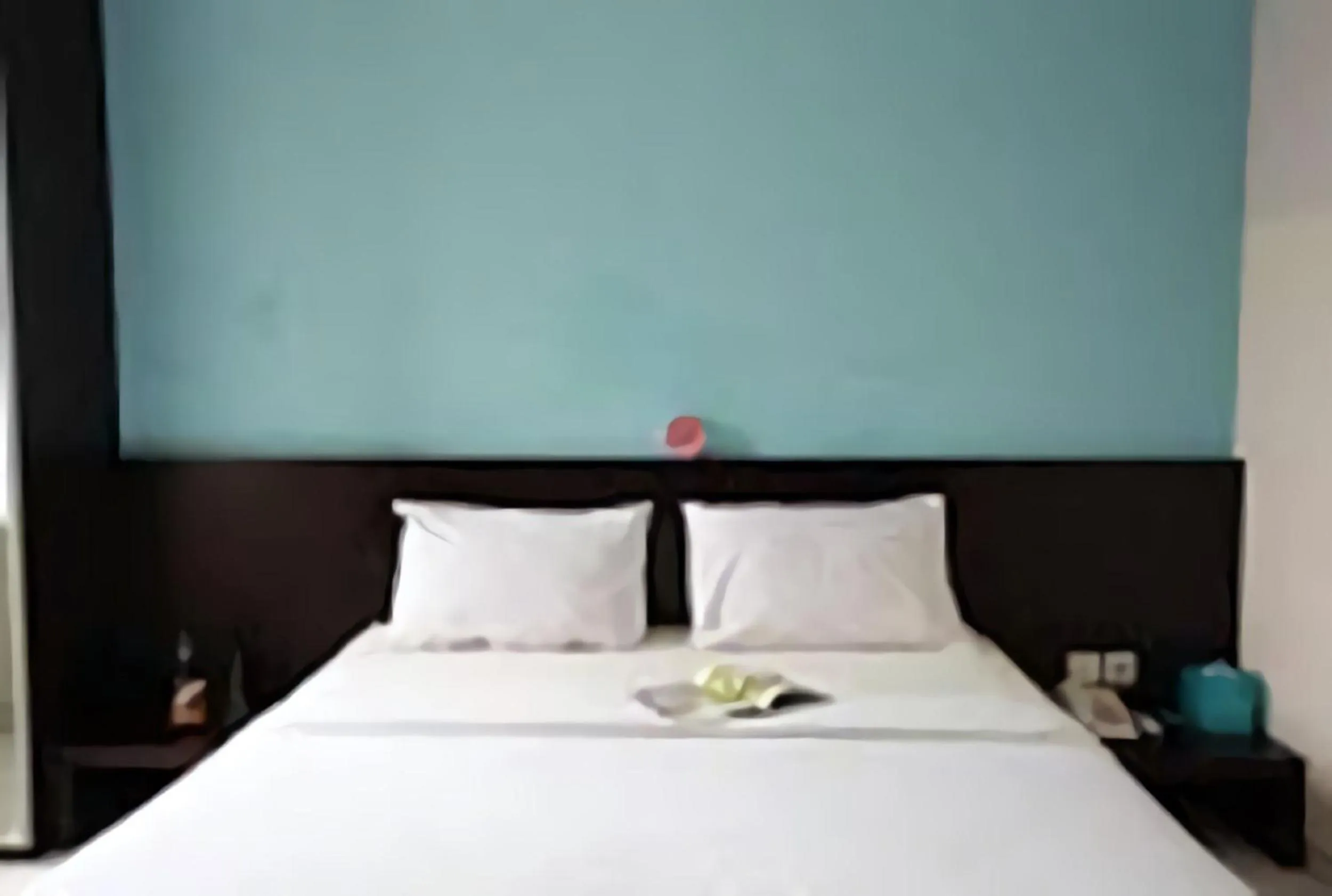 Bed in LeGreen Suite Ratulangi