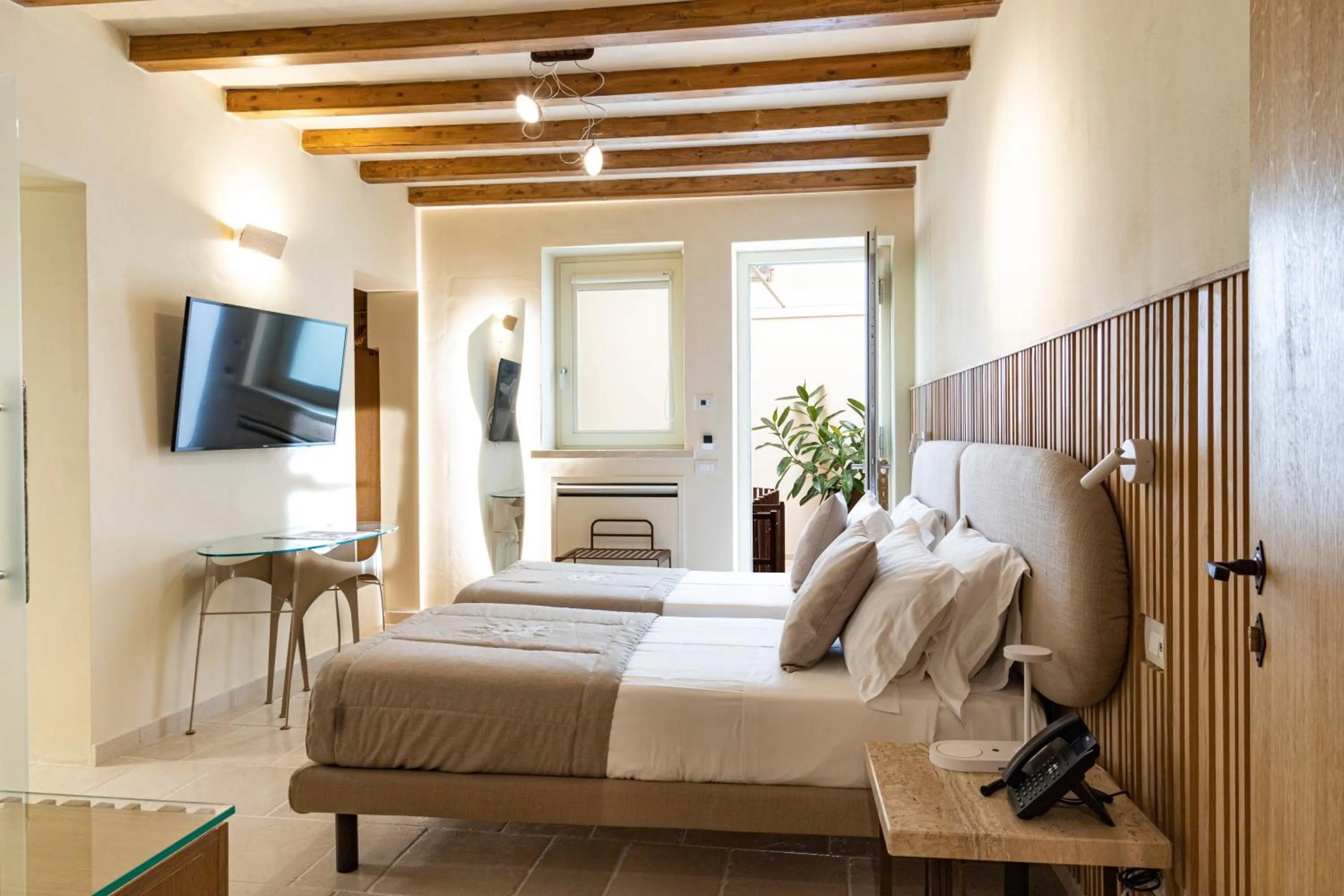 Bed in Pollicastro Boutique Hotel