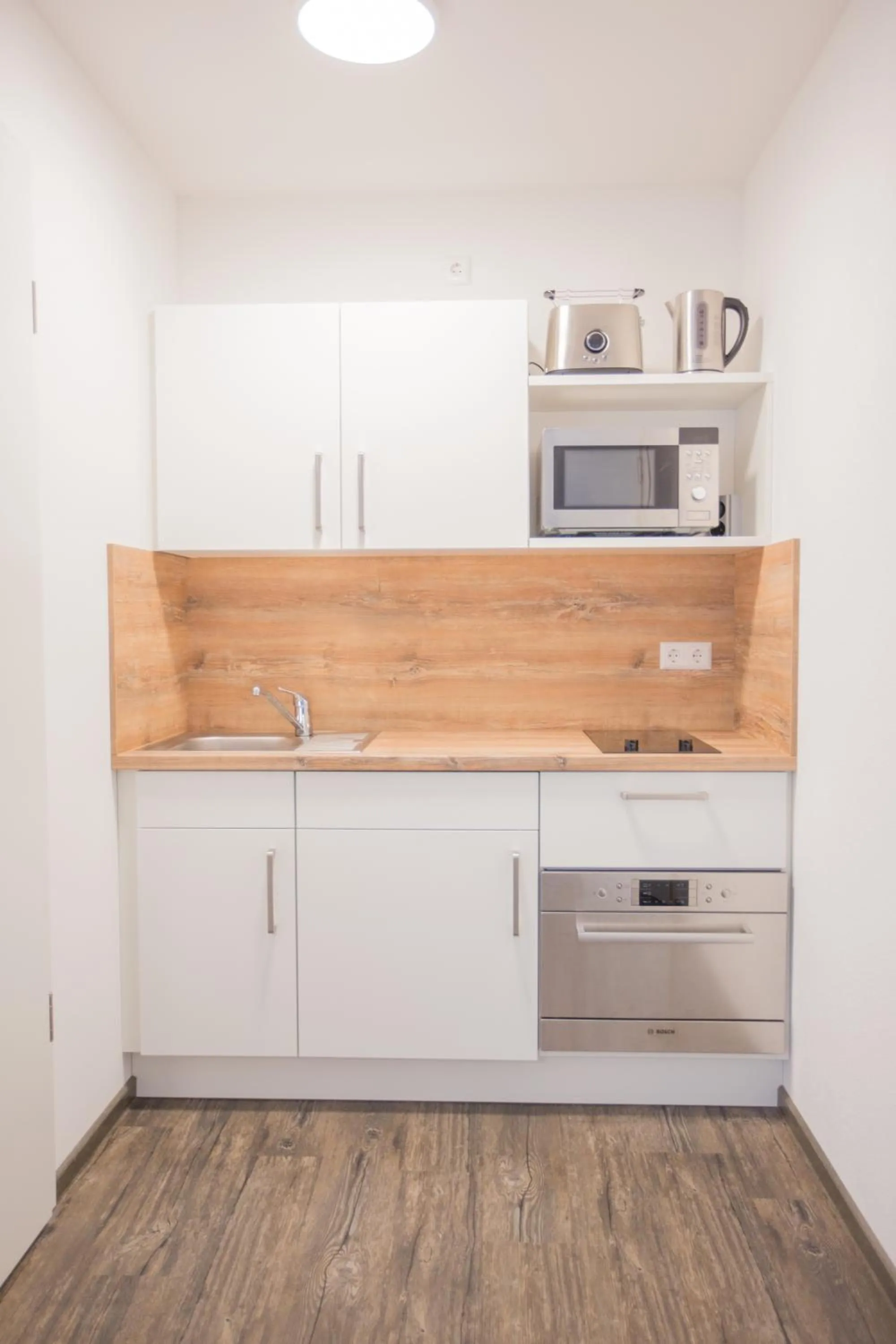 Kitchen or kitchenette in Schoko-Apartments mit Bad & Küche