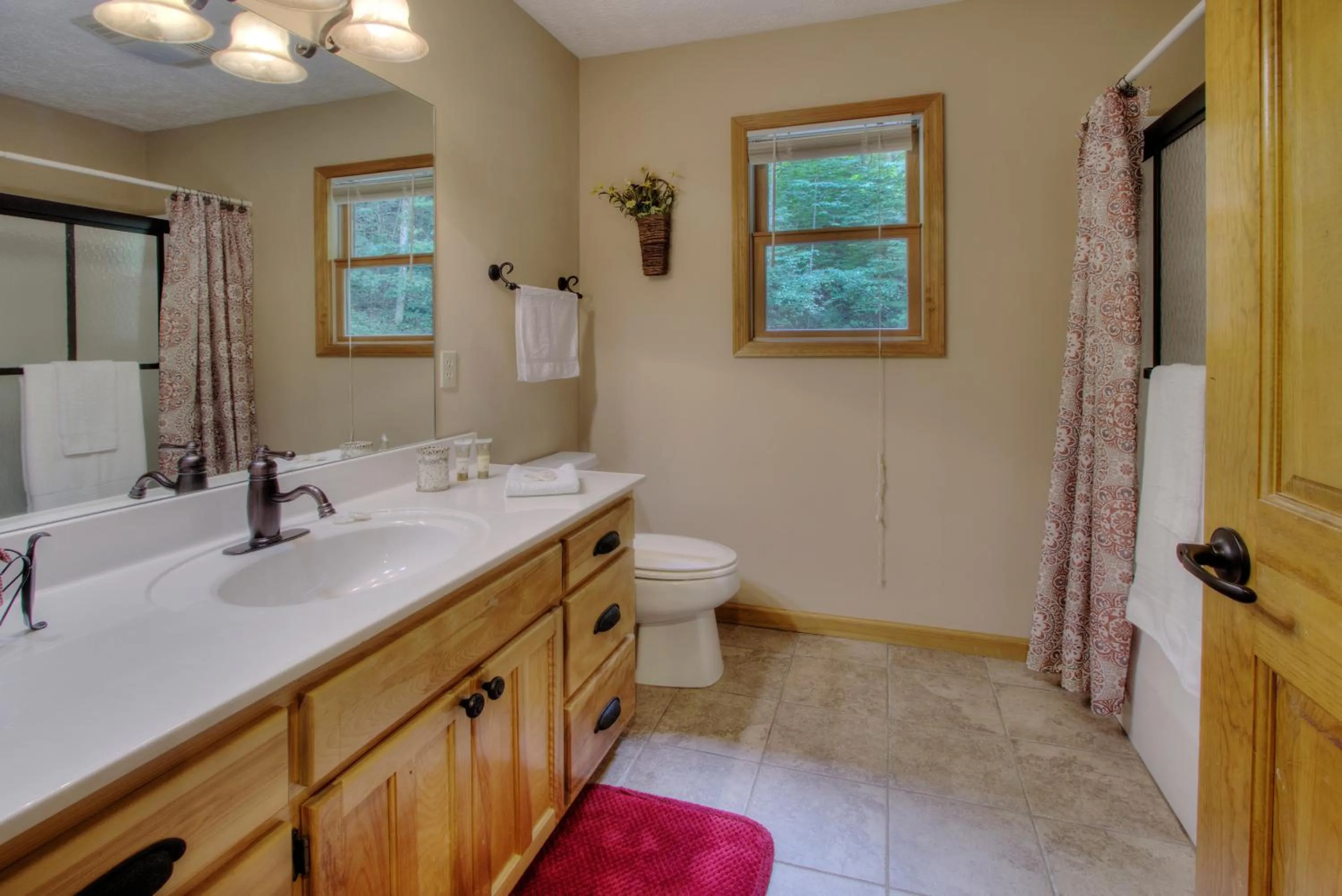 Bathroom in Gorgeous "Country Roads" by HoneyBearCabins 4BR 4BA, next to pool, easy drive, main strip location!
