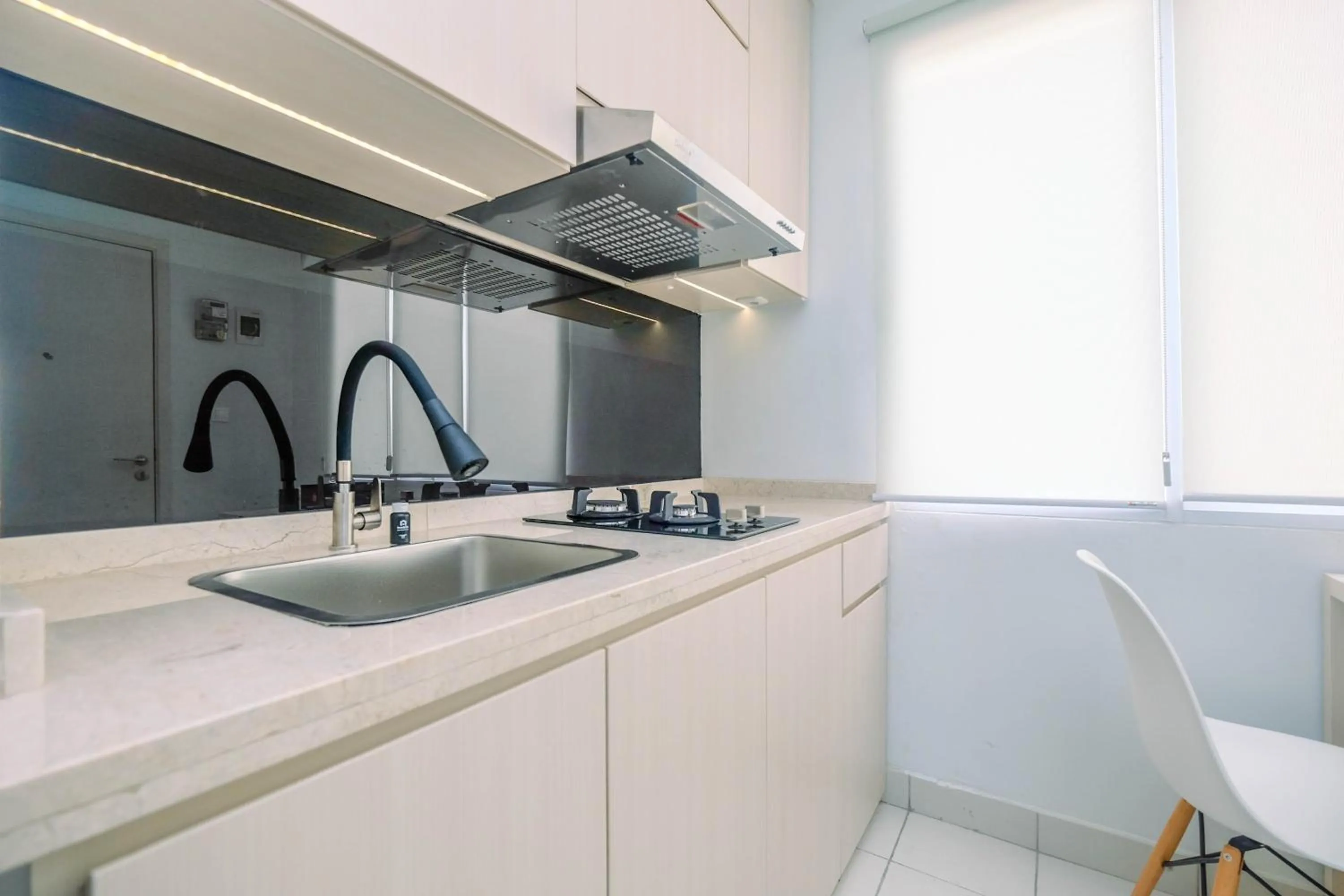 Comfy and Minimalist 1BR Patraland Urbano Apartment near Bekasi Station By Travelio