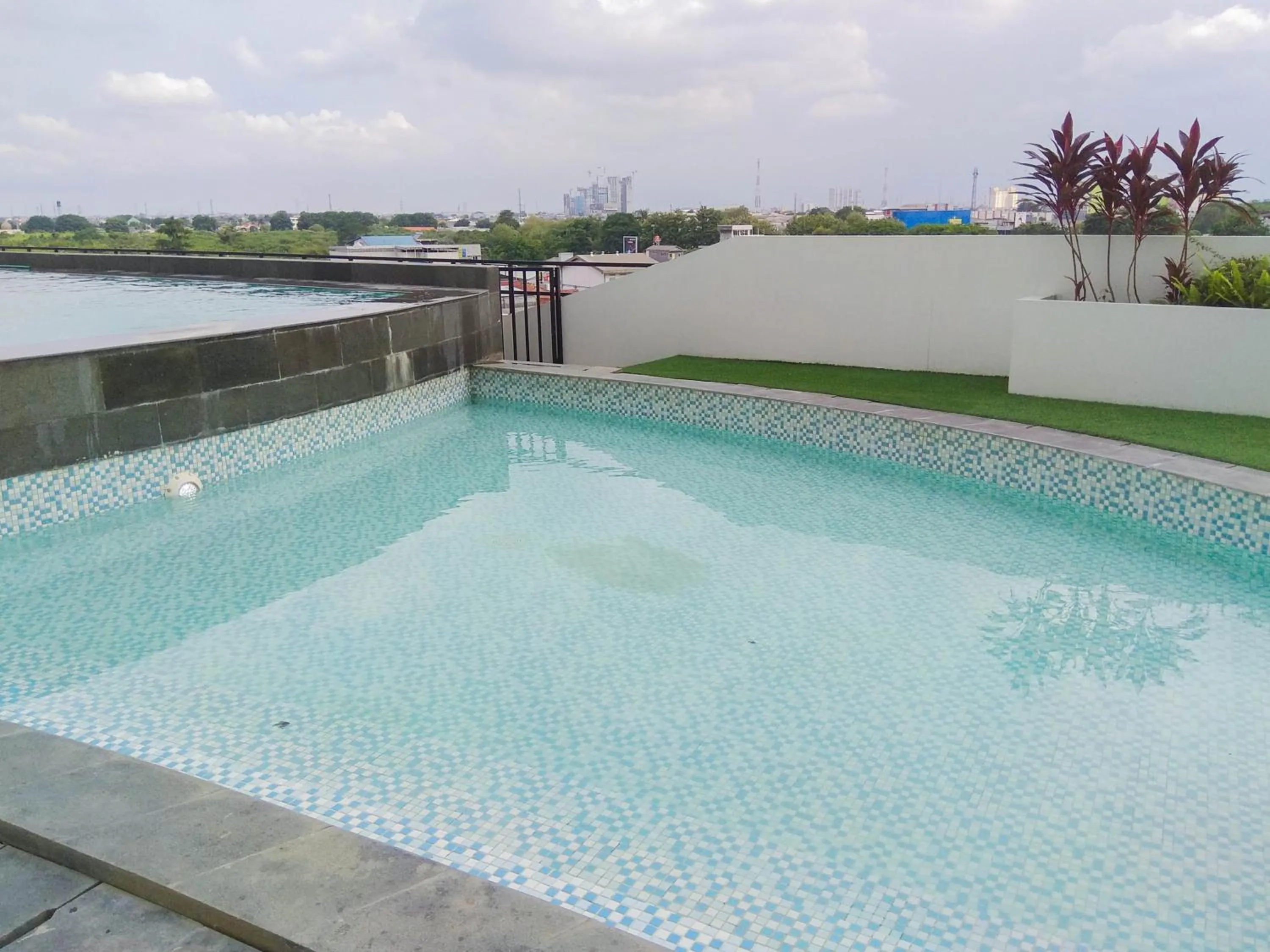 Property building in Comfy and Minimalist 1BR Patraland Urbano Apartment near Bekasi Station By Travelio
